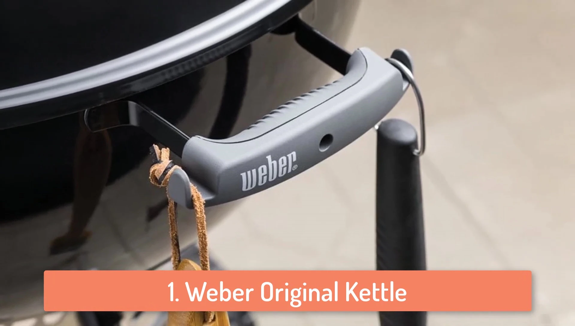 The lid of the Weber Original Kettle, showing the handle and thermometer.
