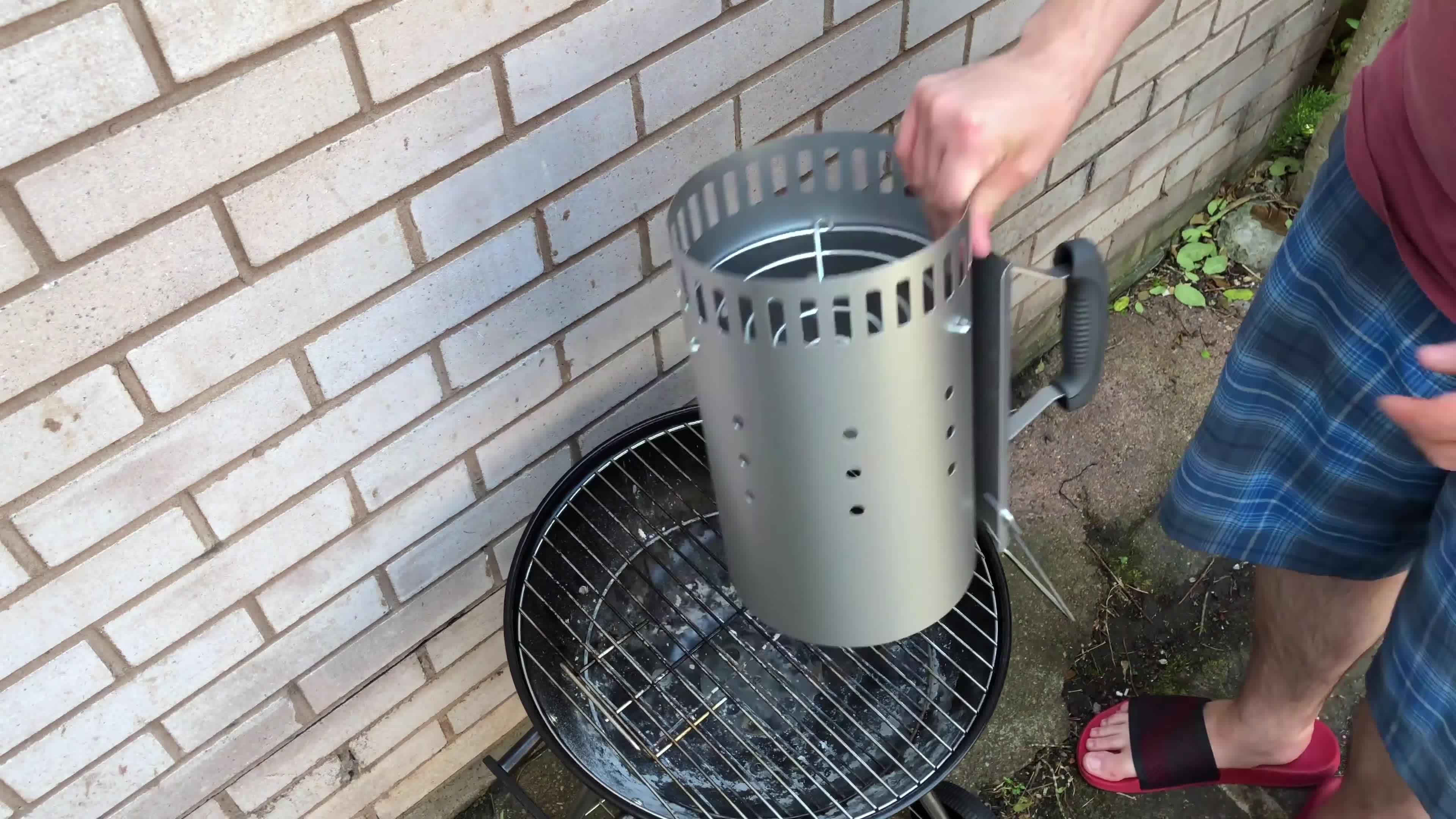 Placing the chimney starter on the barbecue grill