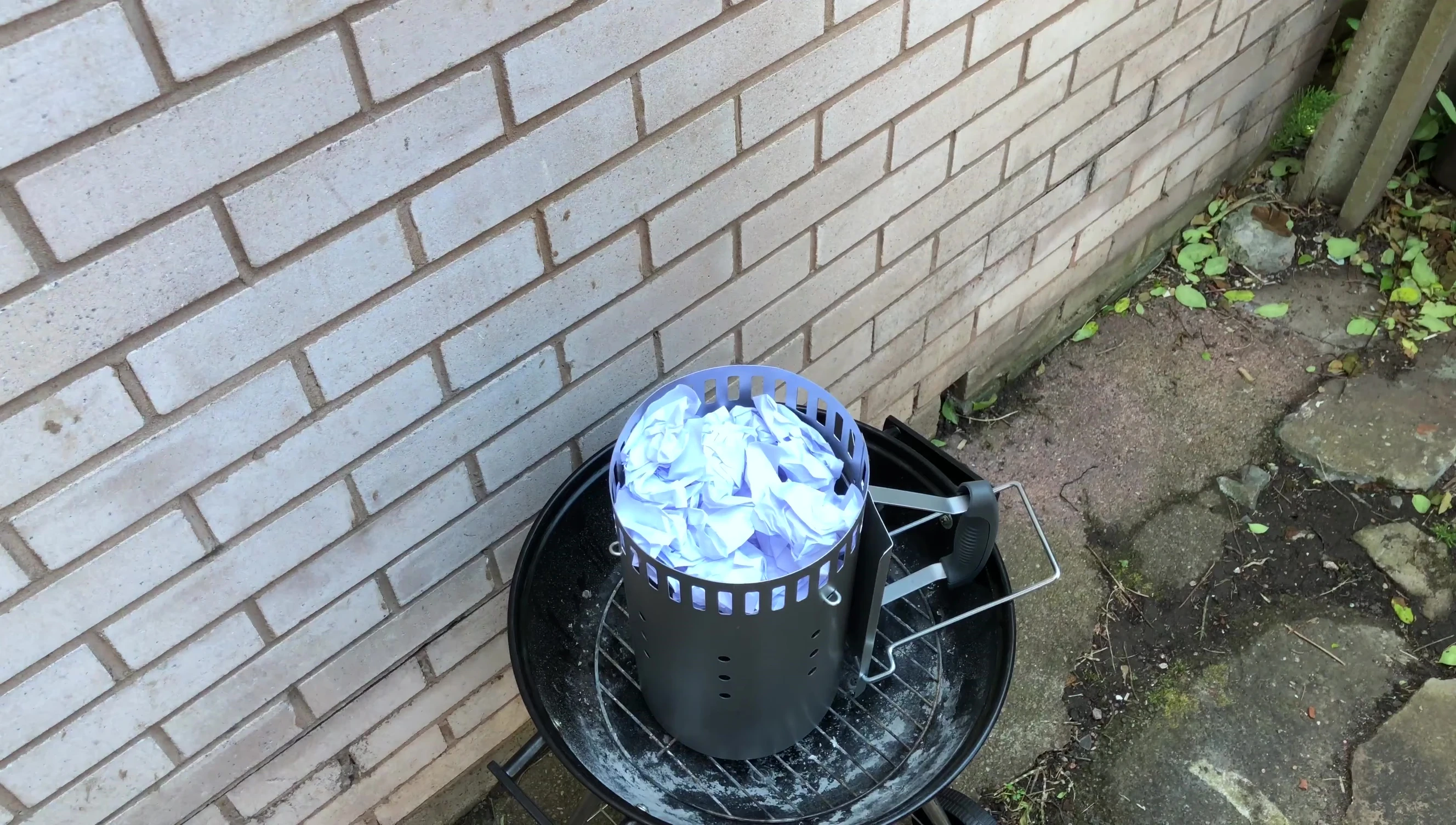 Adding crumpled newspaper at the bottom of the chimney
