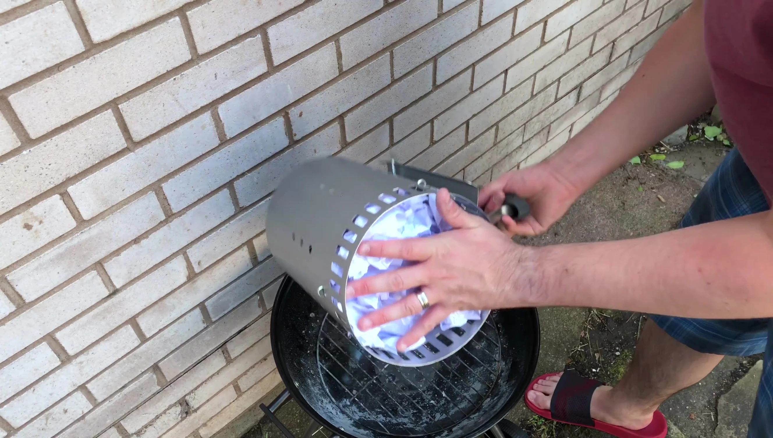 Filling the chimney with charcoal briquettes
