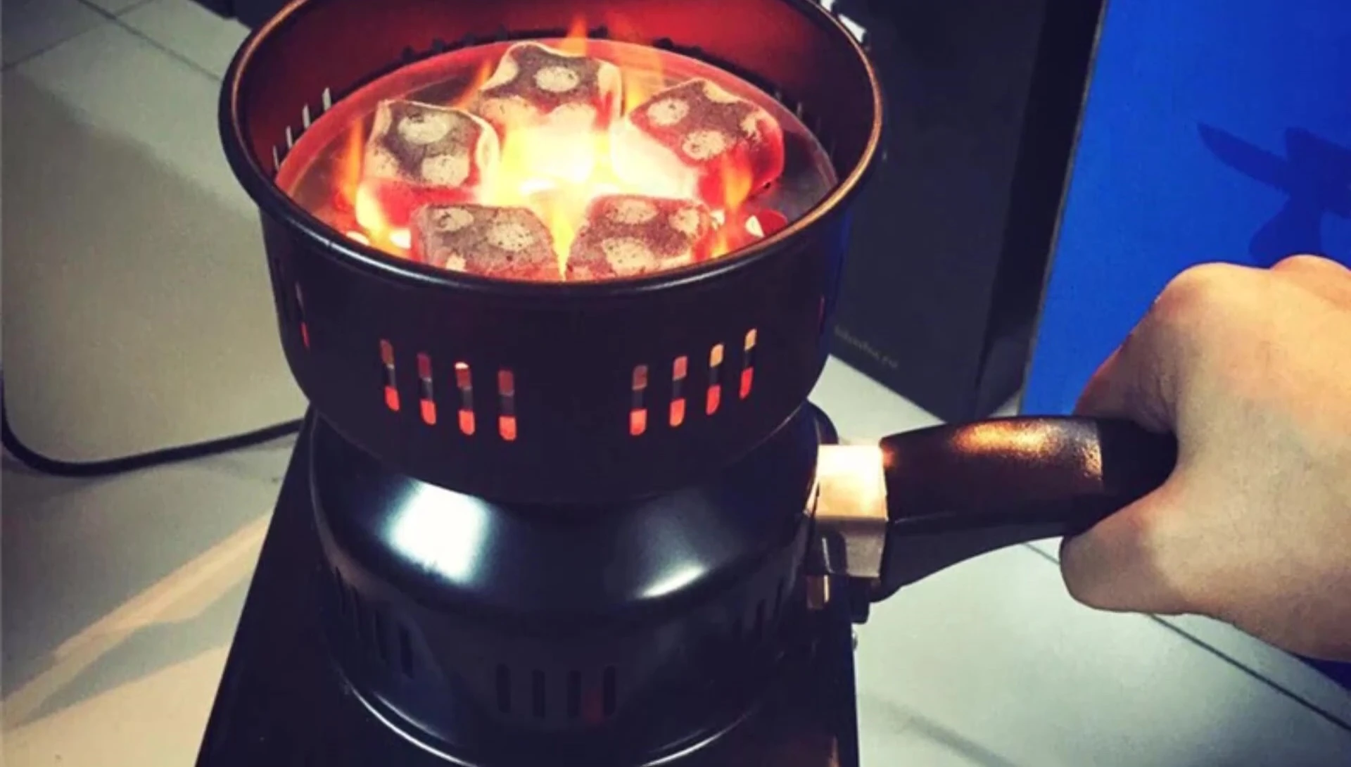 Venon Multi-purpose Charcoal Burner showing removable tray and handle