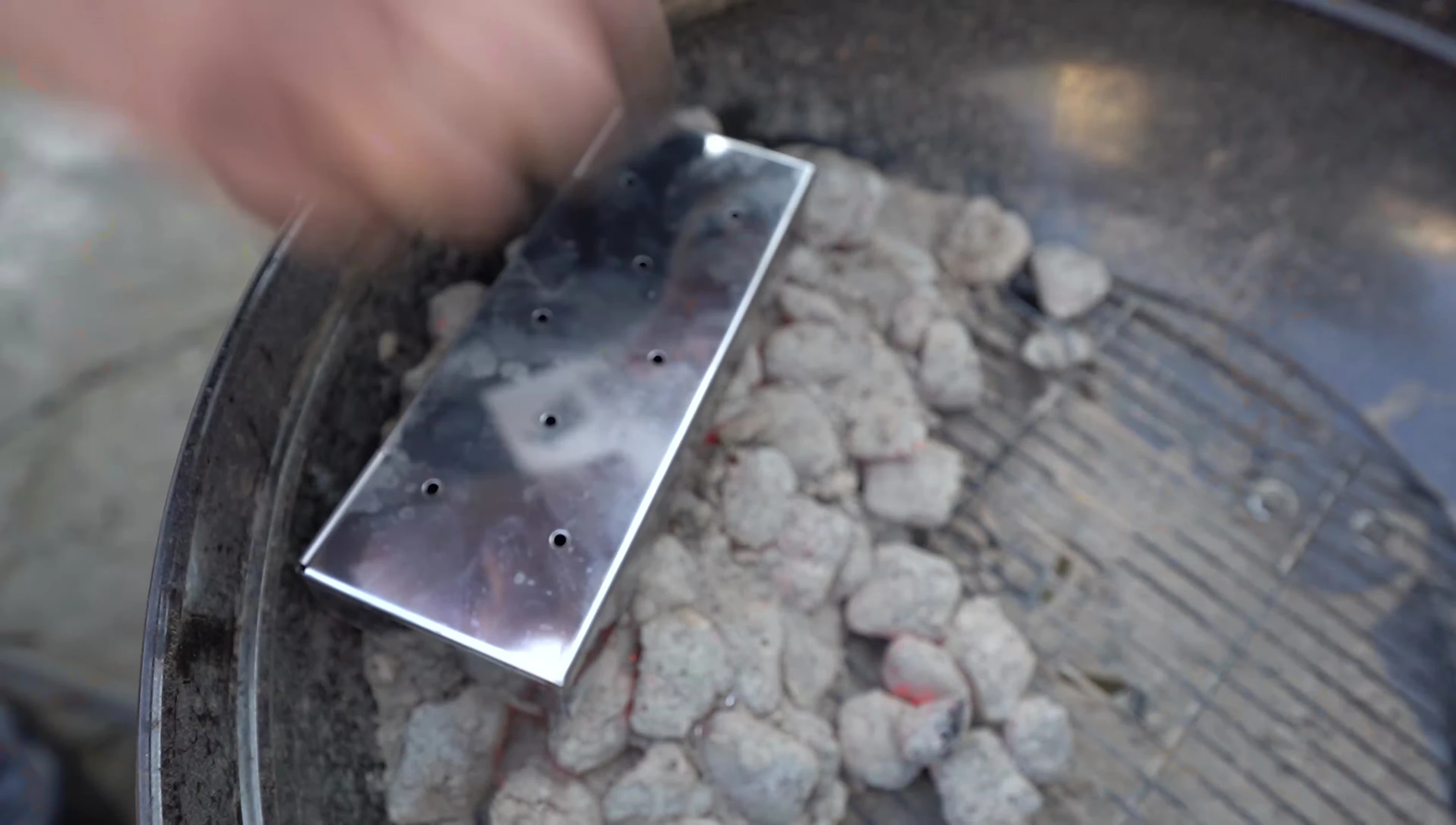 Mr. Bar-B-Q smoker box in use in a smoker/grill.