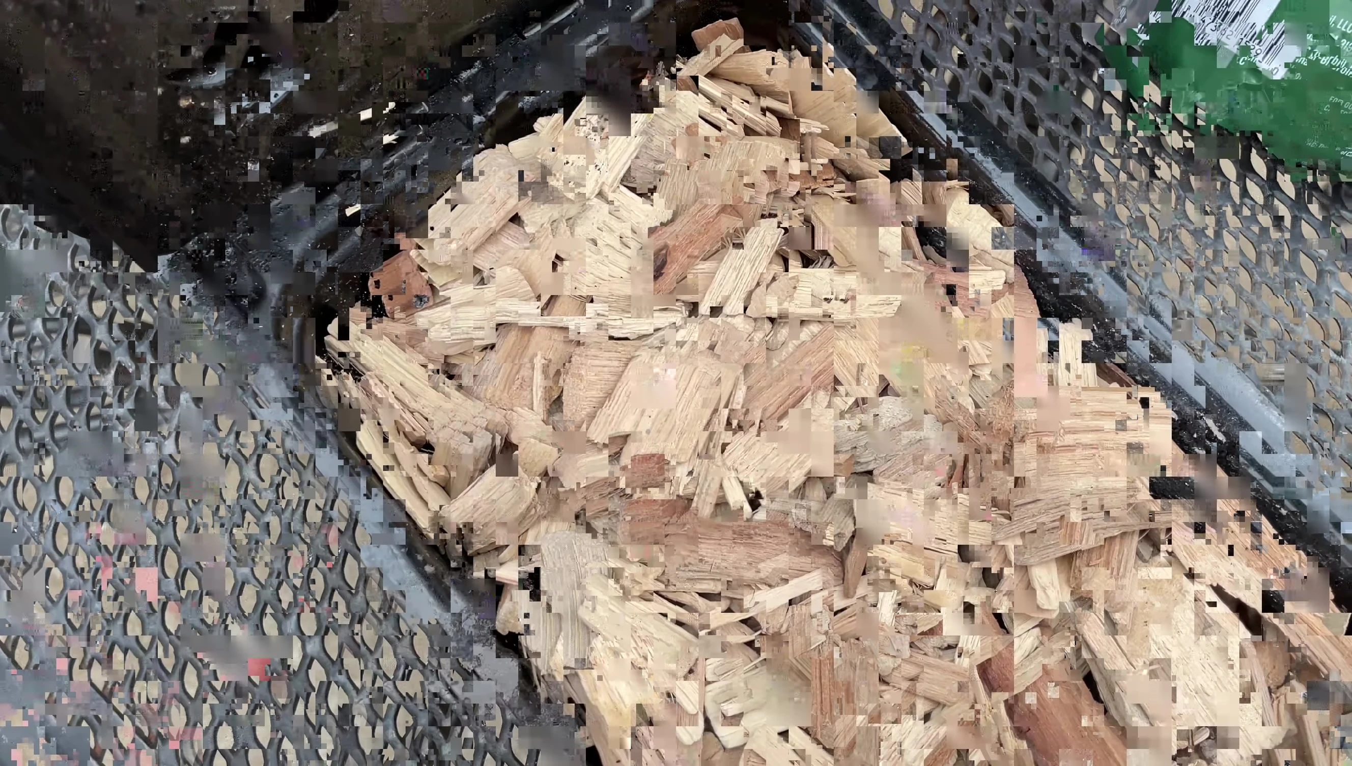 The full Pit Boss wood chip smoker box ready for use.