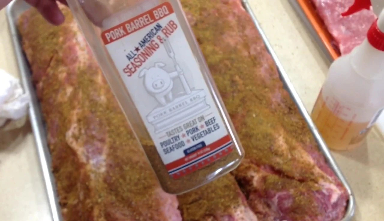 Spraying apple juice on the ribs.
