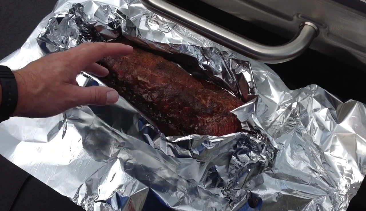 Preparing ribs for foil wrapping.