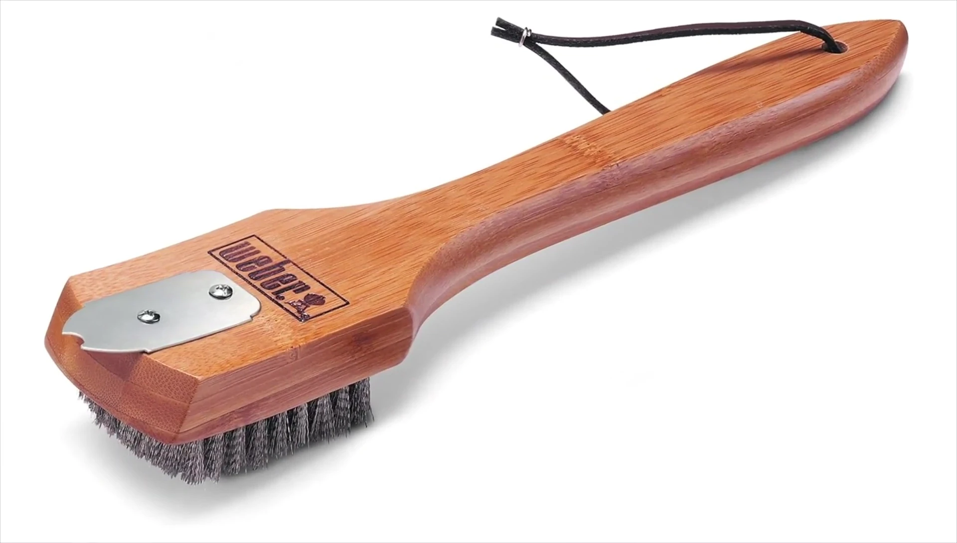 Close-up showing the scraper on the Weber brush