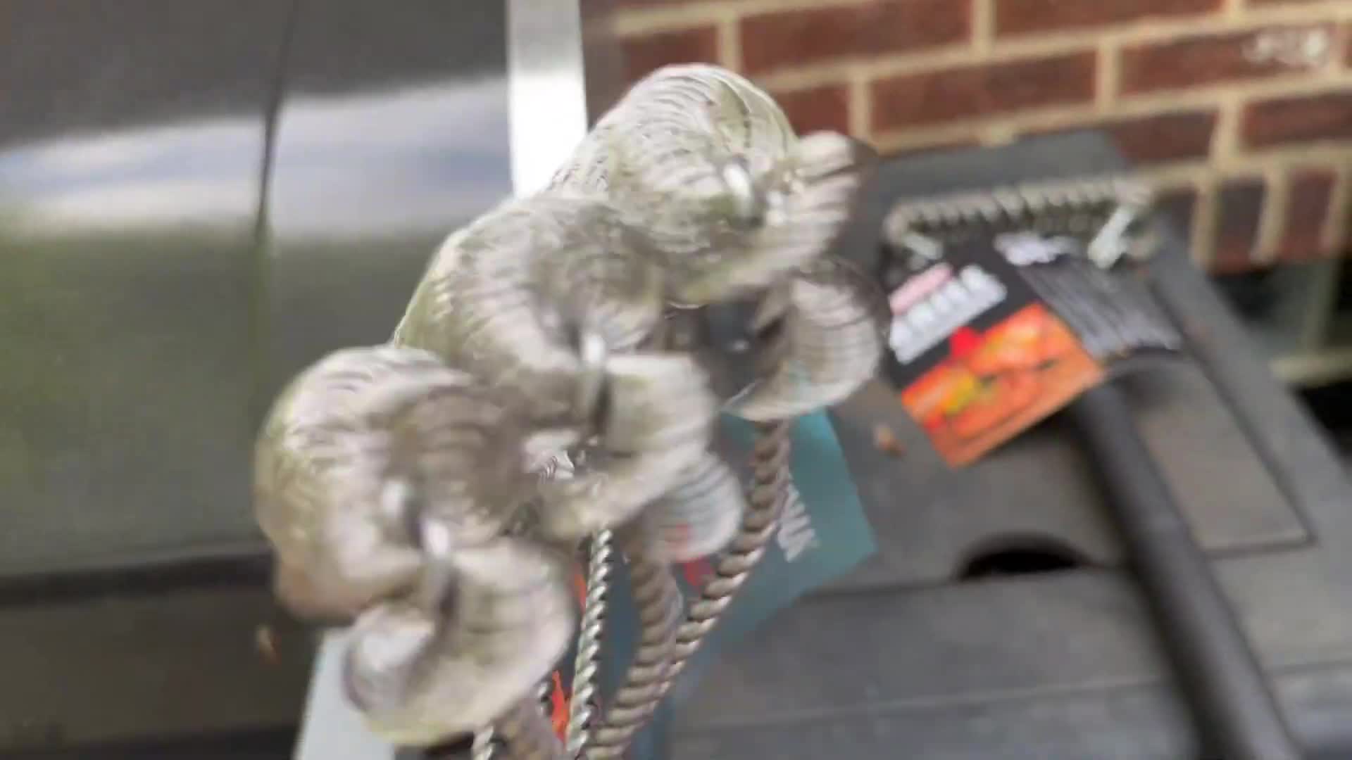 Detailed view of the Kona Grill scraper's wire loops.
