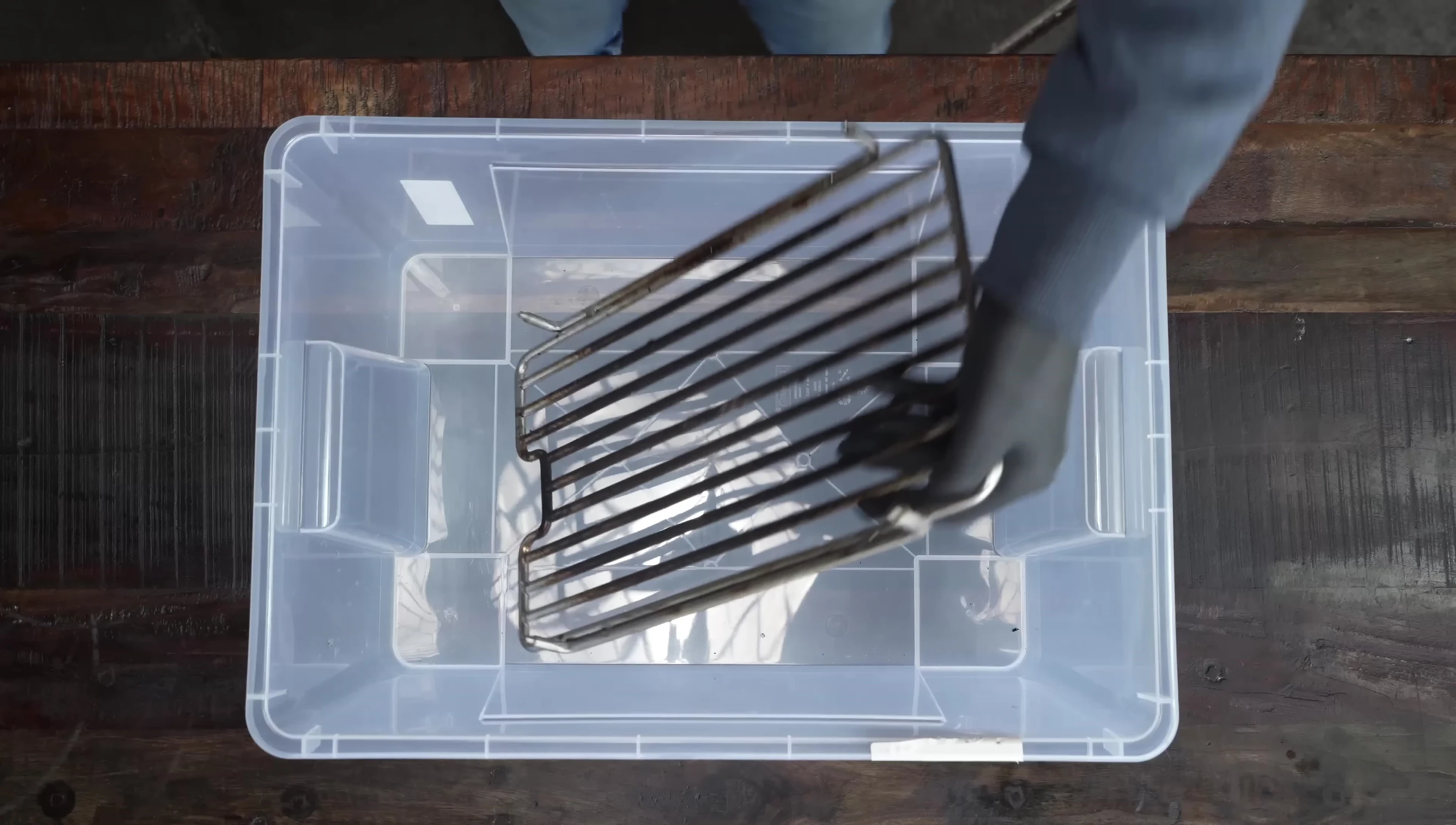 Applying the oven cleaner to the grill grates