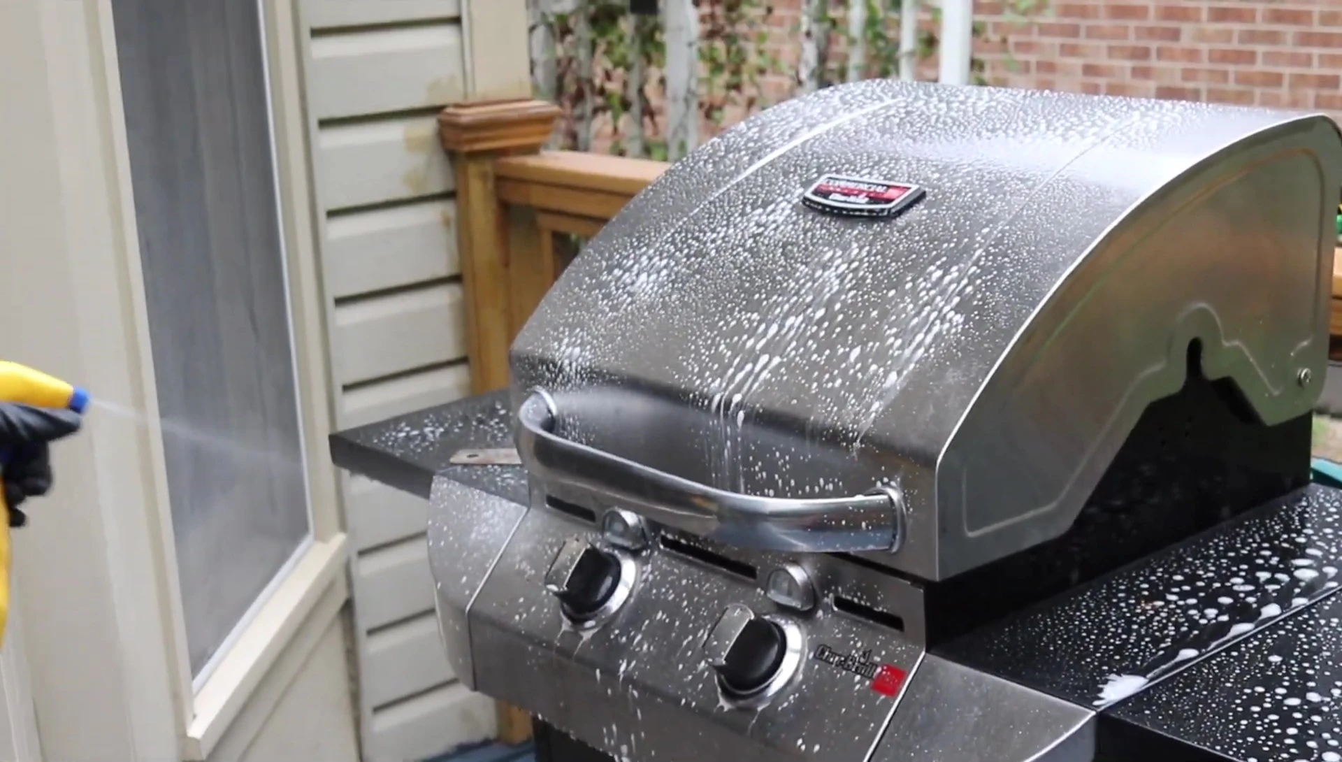 Applying Zep Fast 505 degreaser to the grill exterior