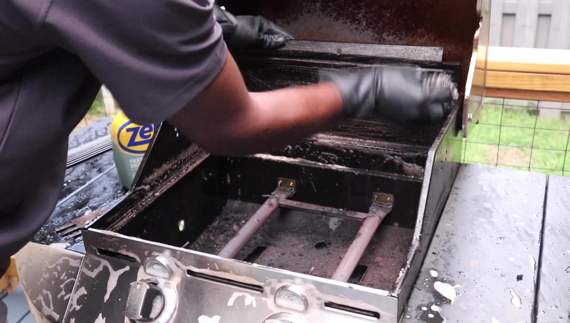 Scrubbing the grill interior and exterior