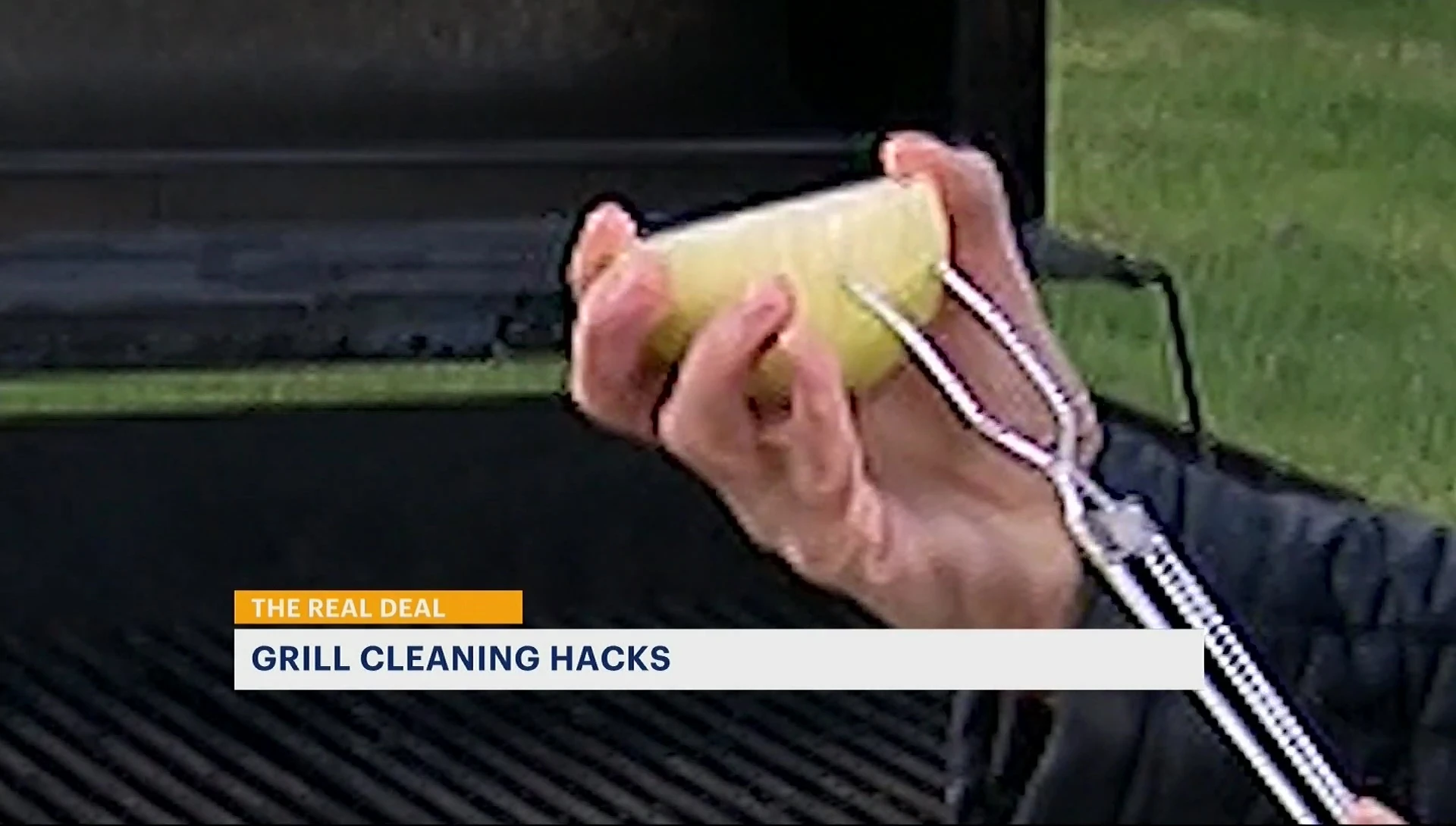 Using half an onion to scrub the grill grates.