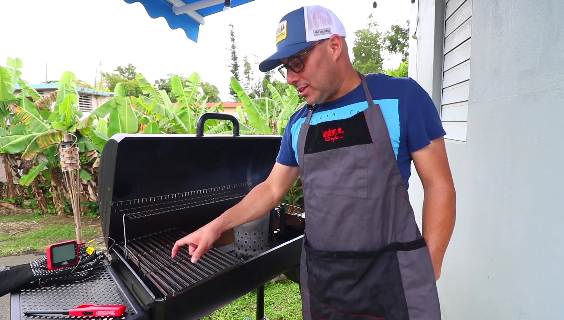 A shot highlighting the smoker's internal grates and the seasoning effect.
