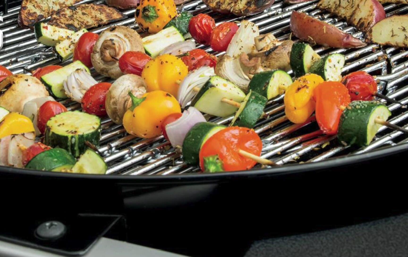 Close-up of the Weber Performer Deluxe's copper bowl and attached table