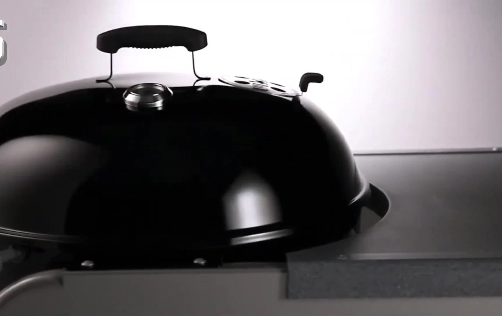 The side table of the Weber Performer Deluxe showing prep space