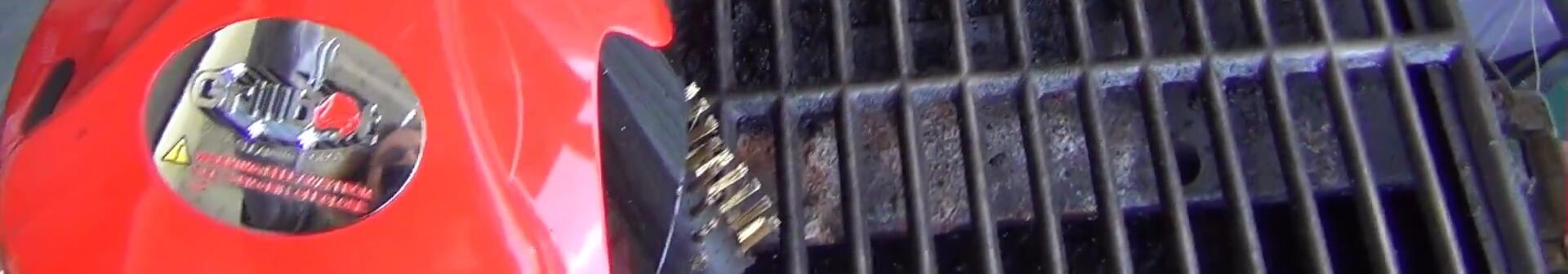The user showing the grill after cleaning.
