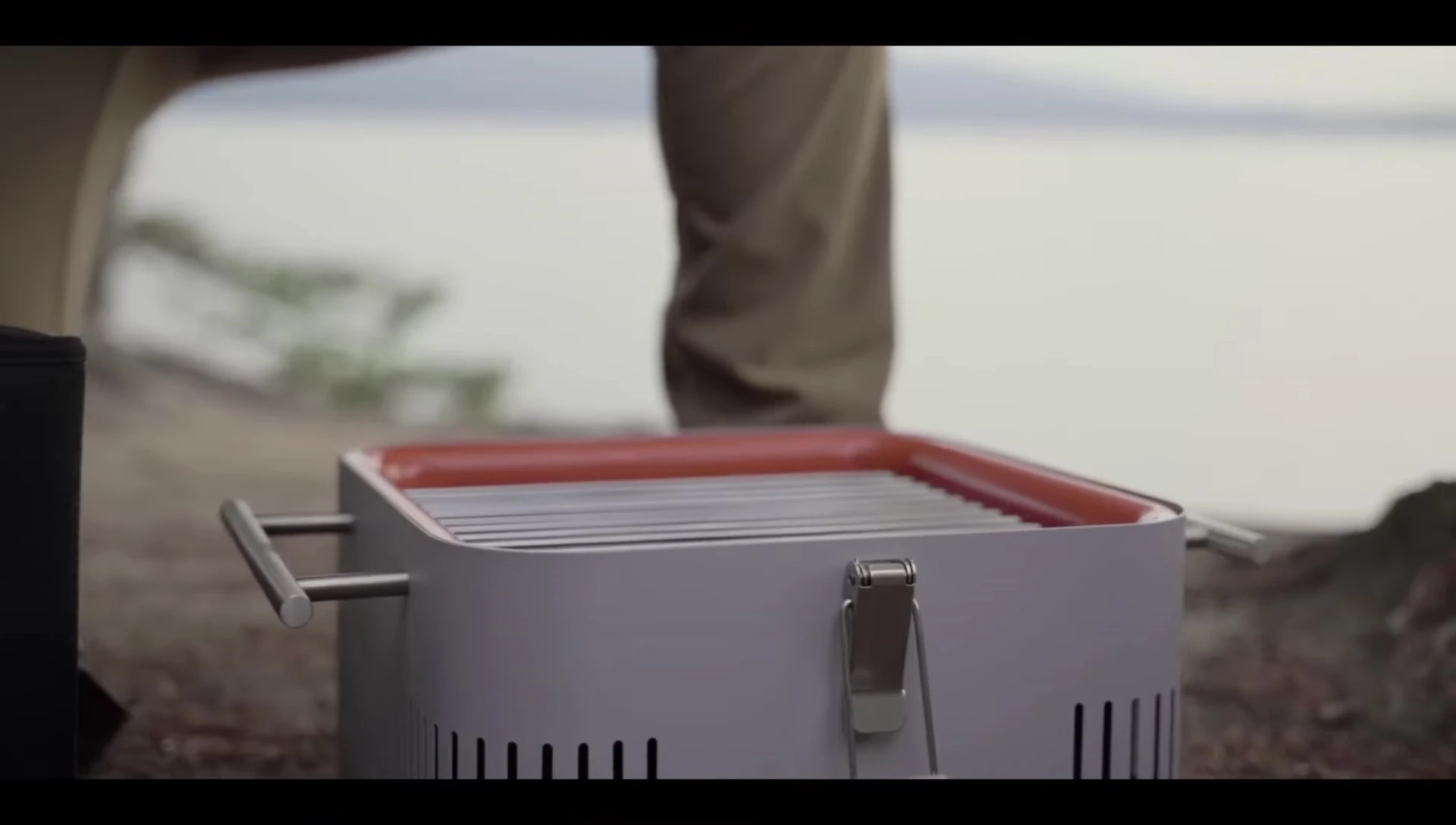 The bamboo lid of the Cube Grill being used as a cutting board.