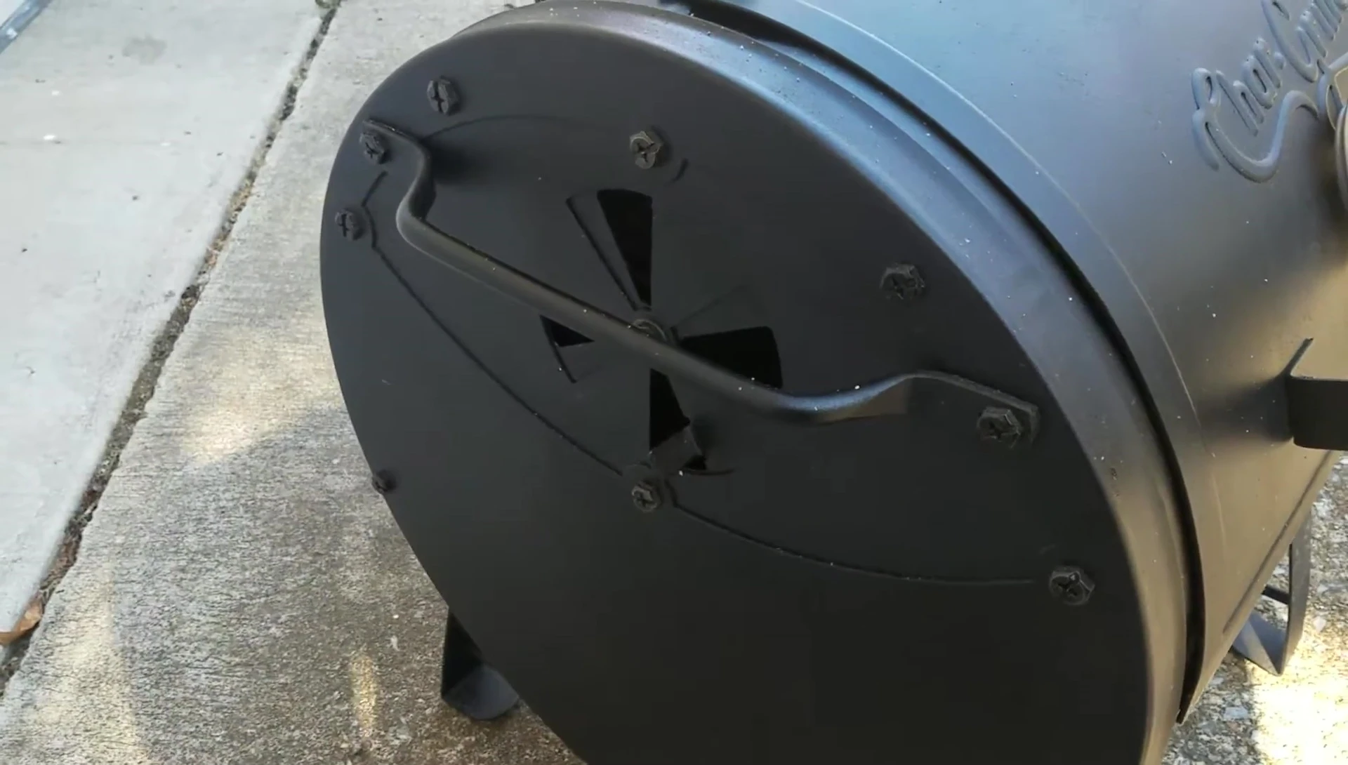 The handle showing grease and smoke buildup.