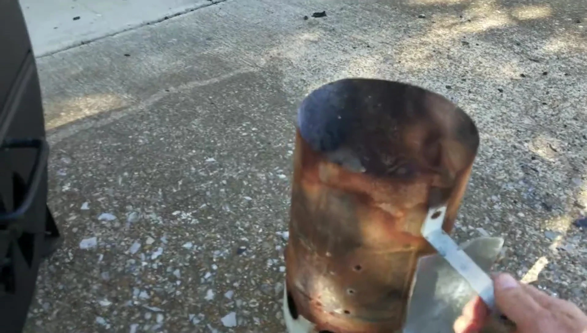 The partially filled chimney starter.
