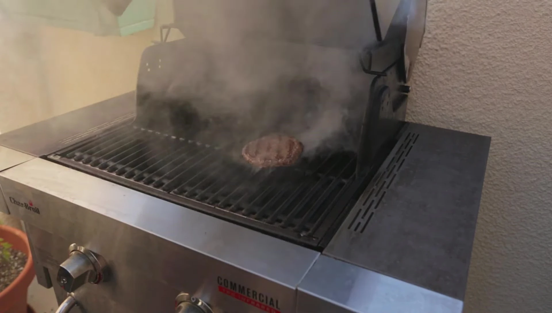 Close-up shot showing food on the grill grates, highlighting any uneven cooking areas.