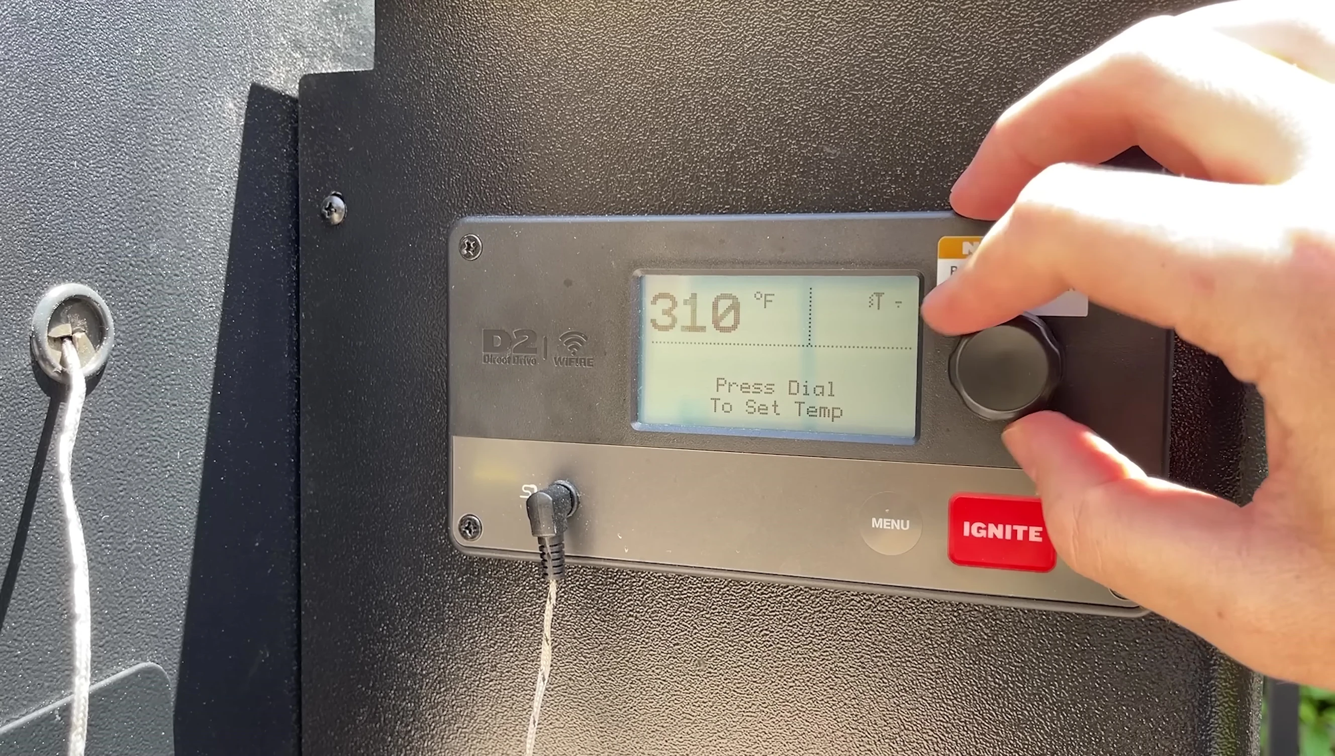 Control panel of the Traeger grill showing the temperature setting