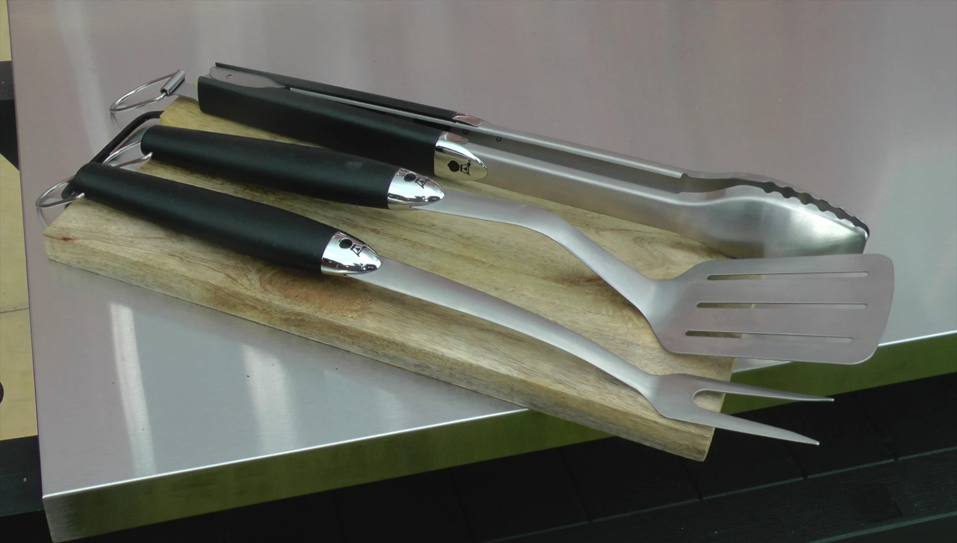 A comparison shot showing both the Weber and supermarket tools.