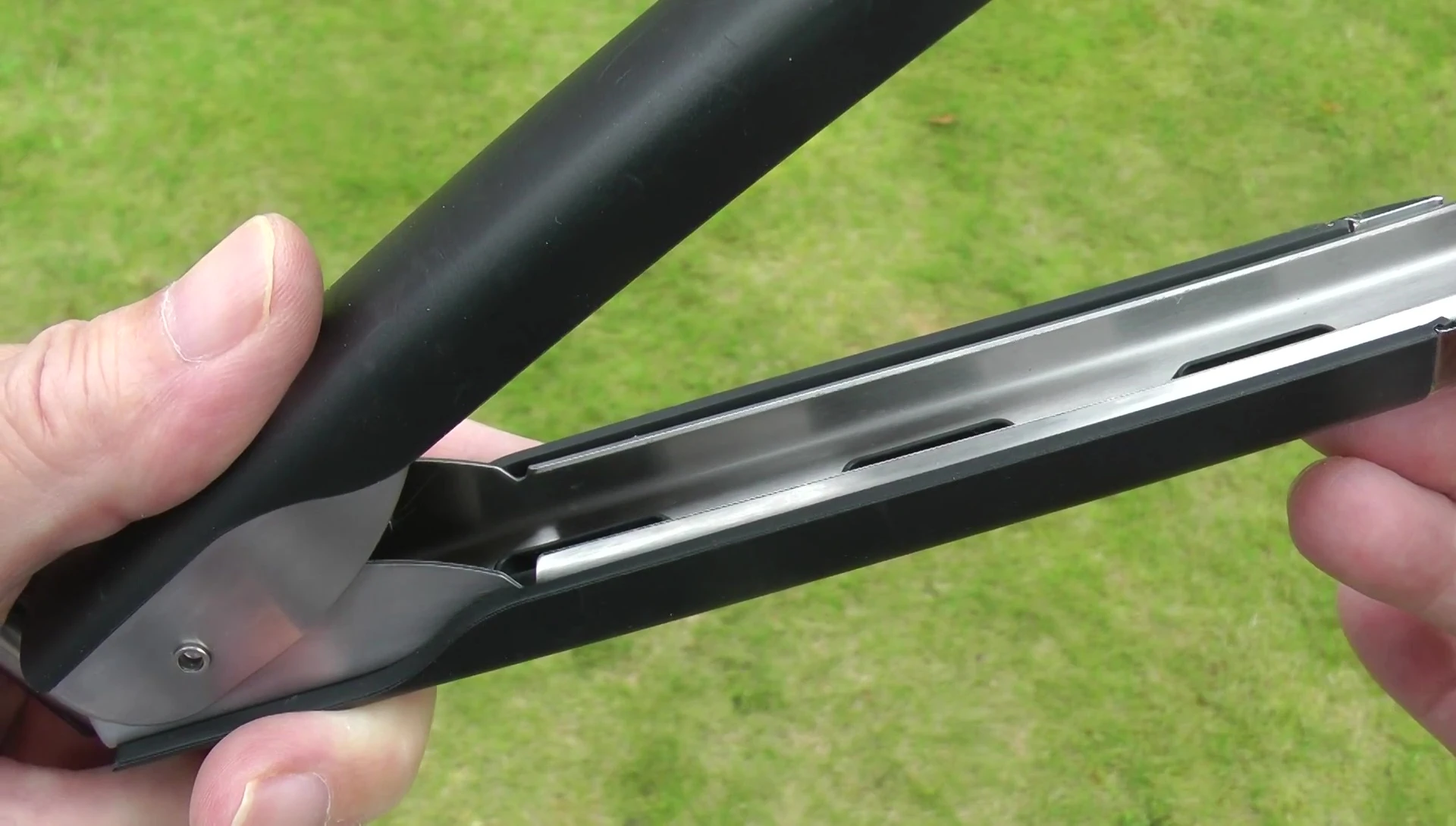 Close-up of the Weber tongs highlighting their robust construction.