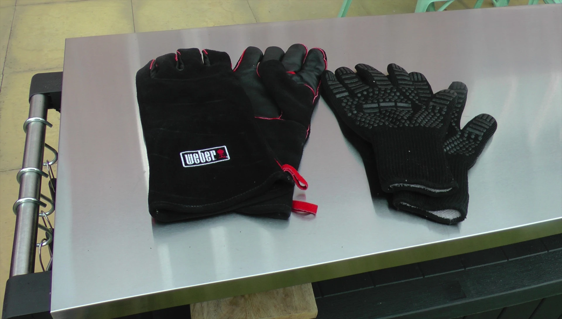 The reviewer holding the knitted gloves, his preferred choice.