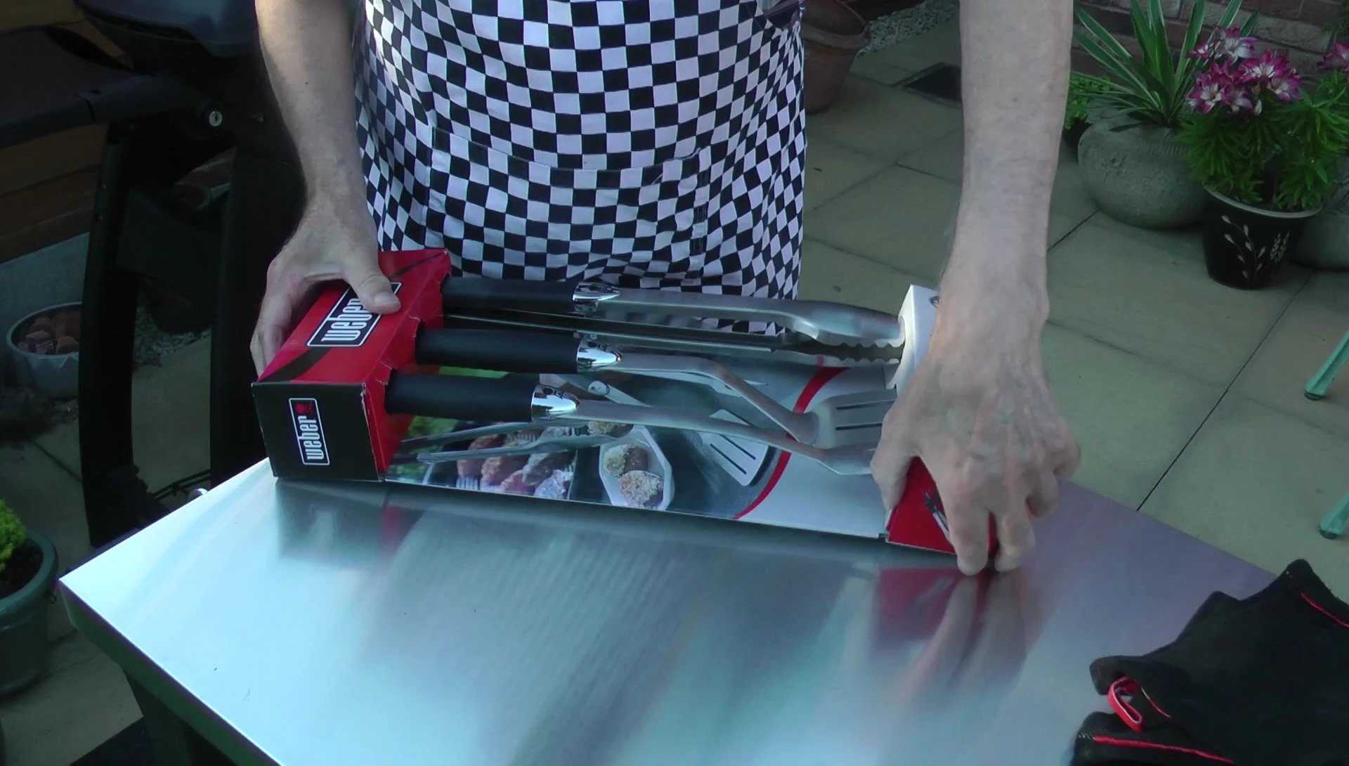 Close-up of the Weber BBQ tools still in their packaging.