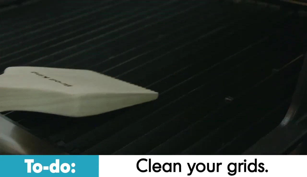 Cleaning grates with a wooden scraper