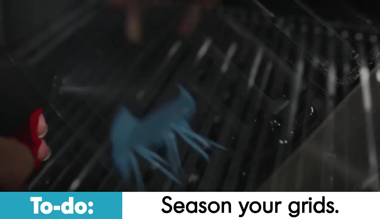 Applying oil to the grates with a brush