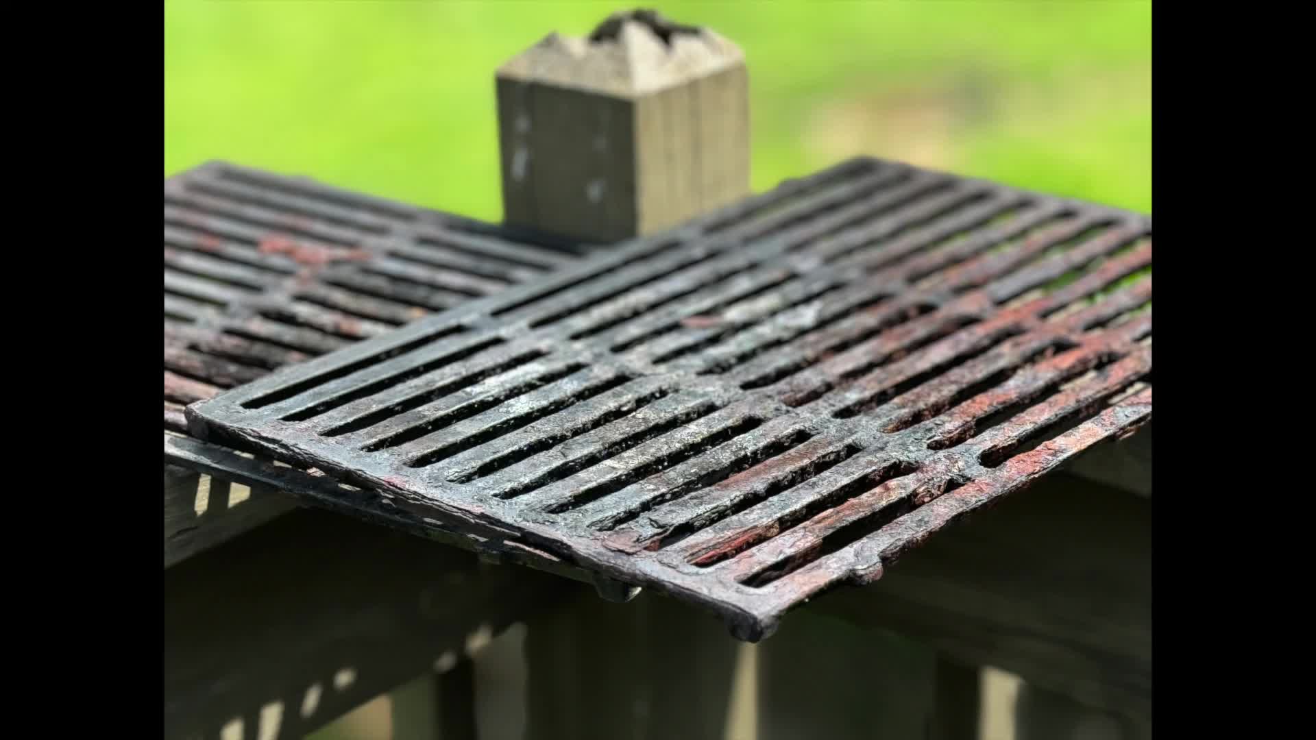 Close-up of heavily rusted grill grates.
