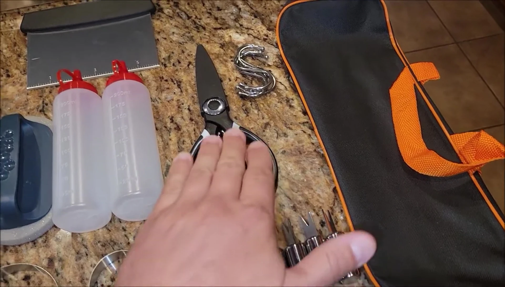 The reviewer is holding up some of the hooks.