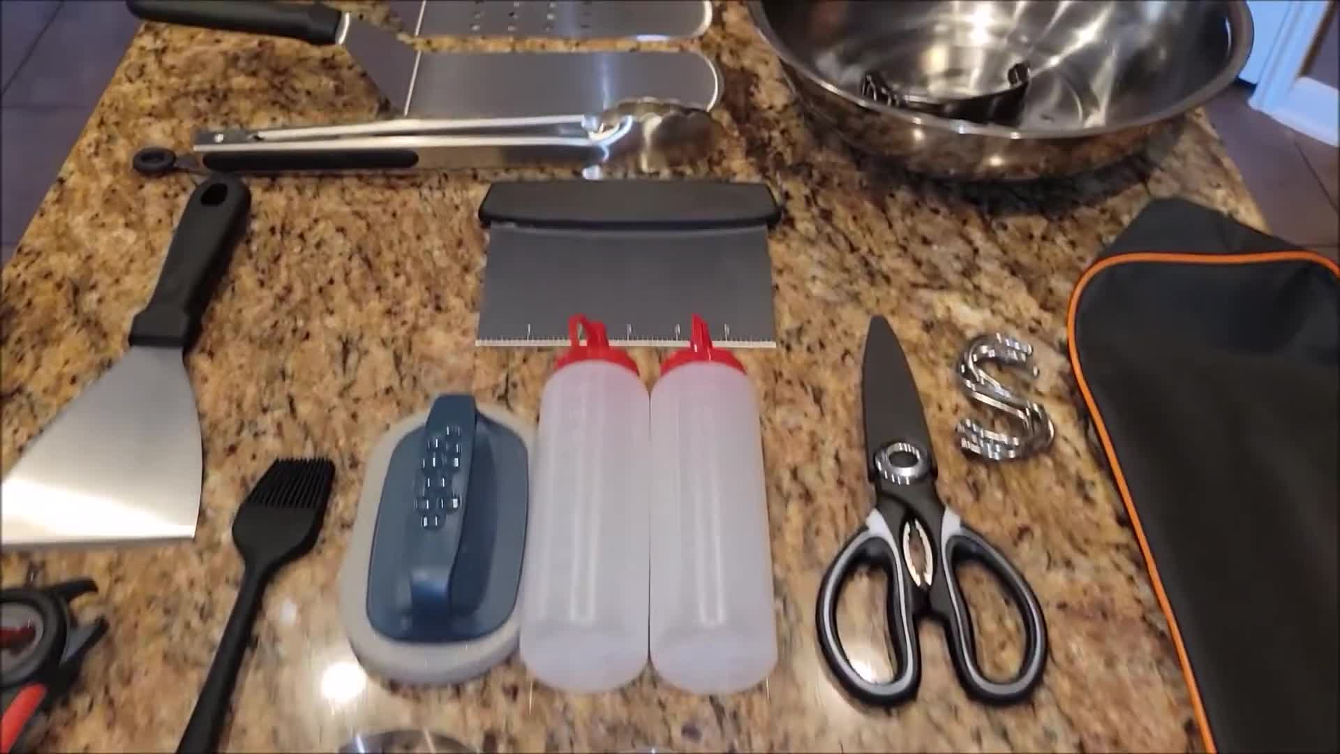 The reviewer displaying the contents of the box, showcasing the variety of tools.