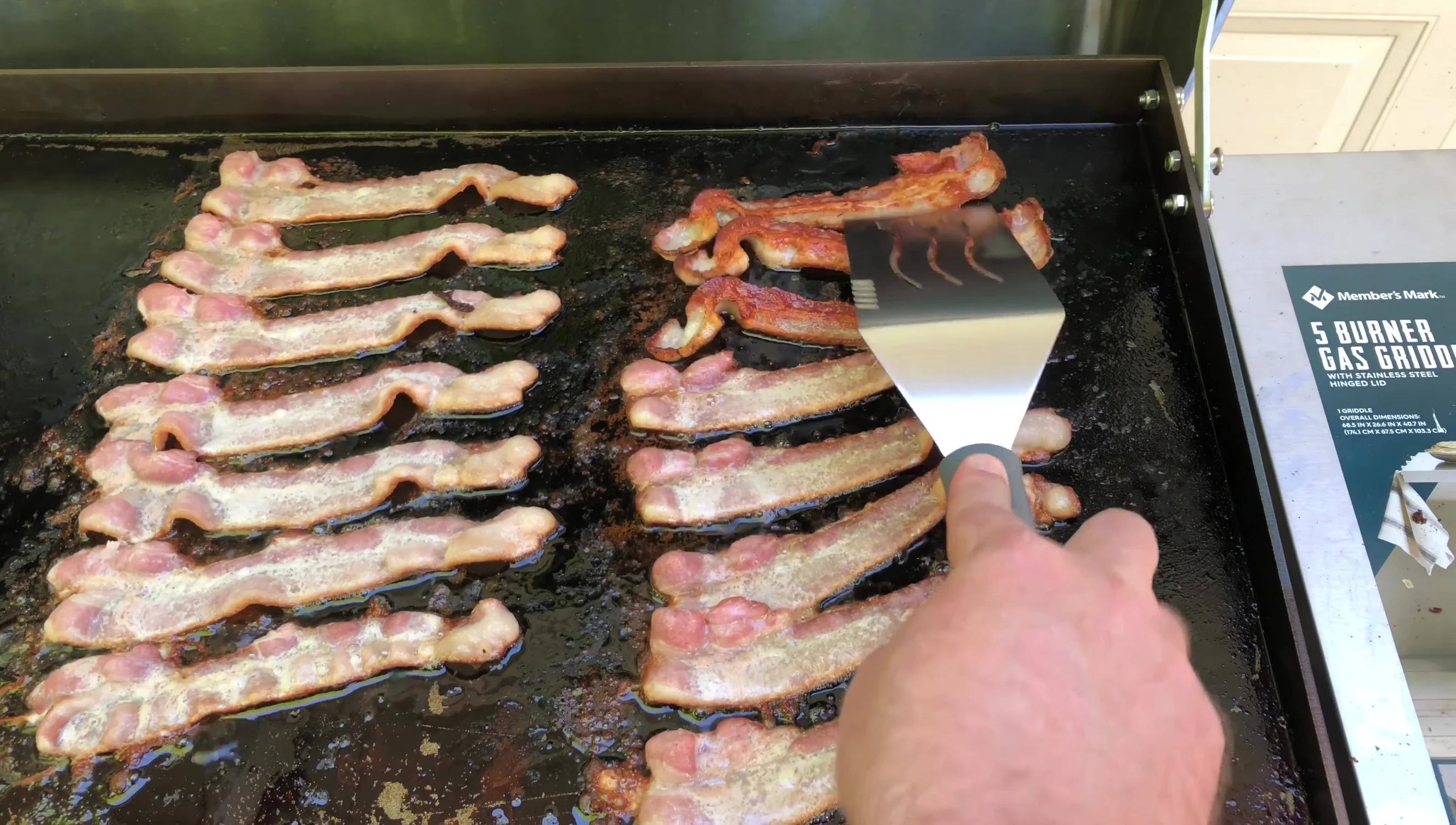 Cooked bacon on the griddle.