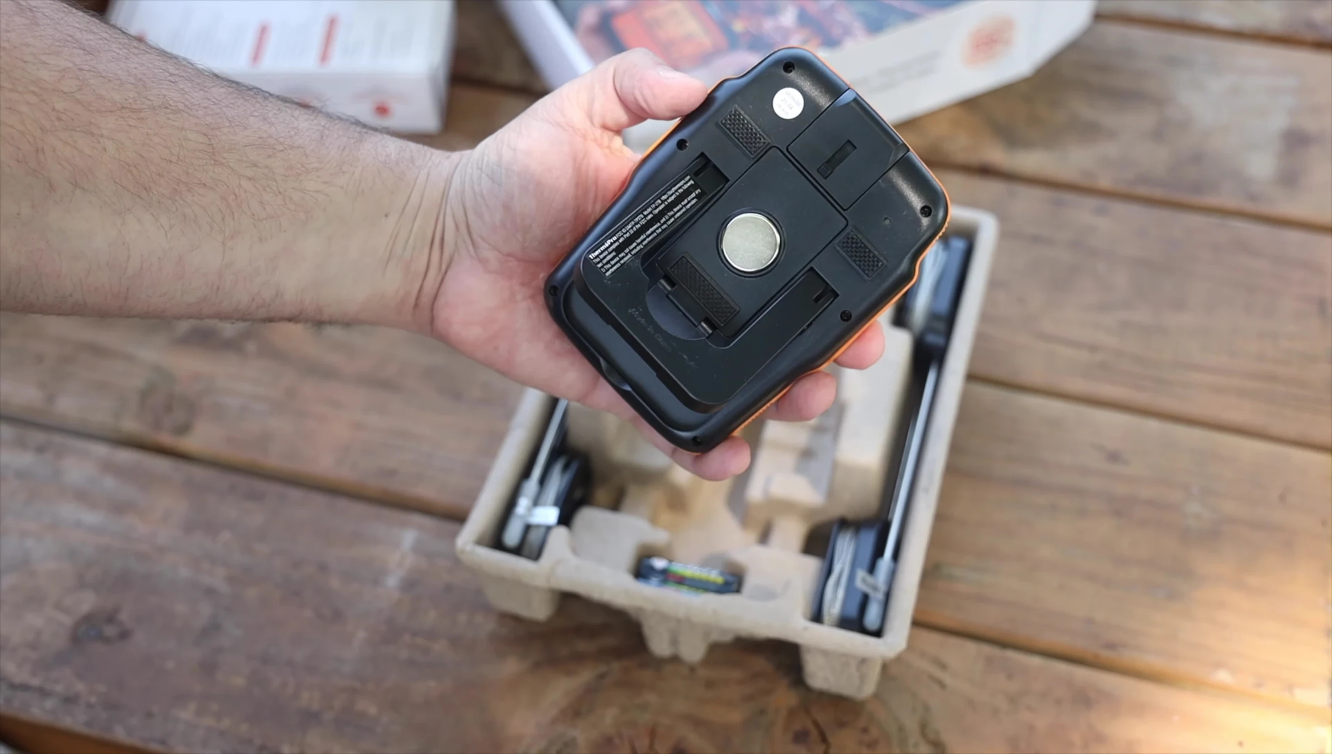 The transmitter and receiver units showing magnets and clips