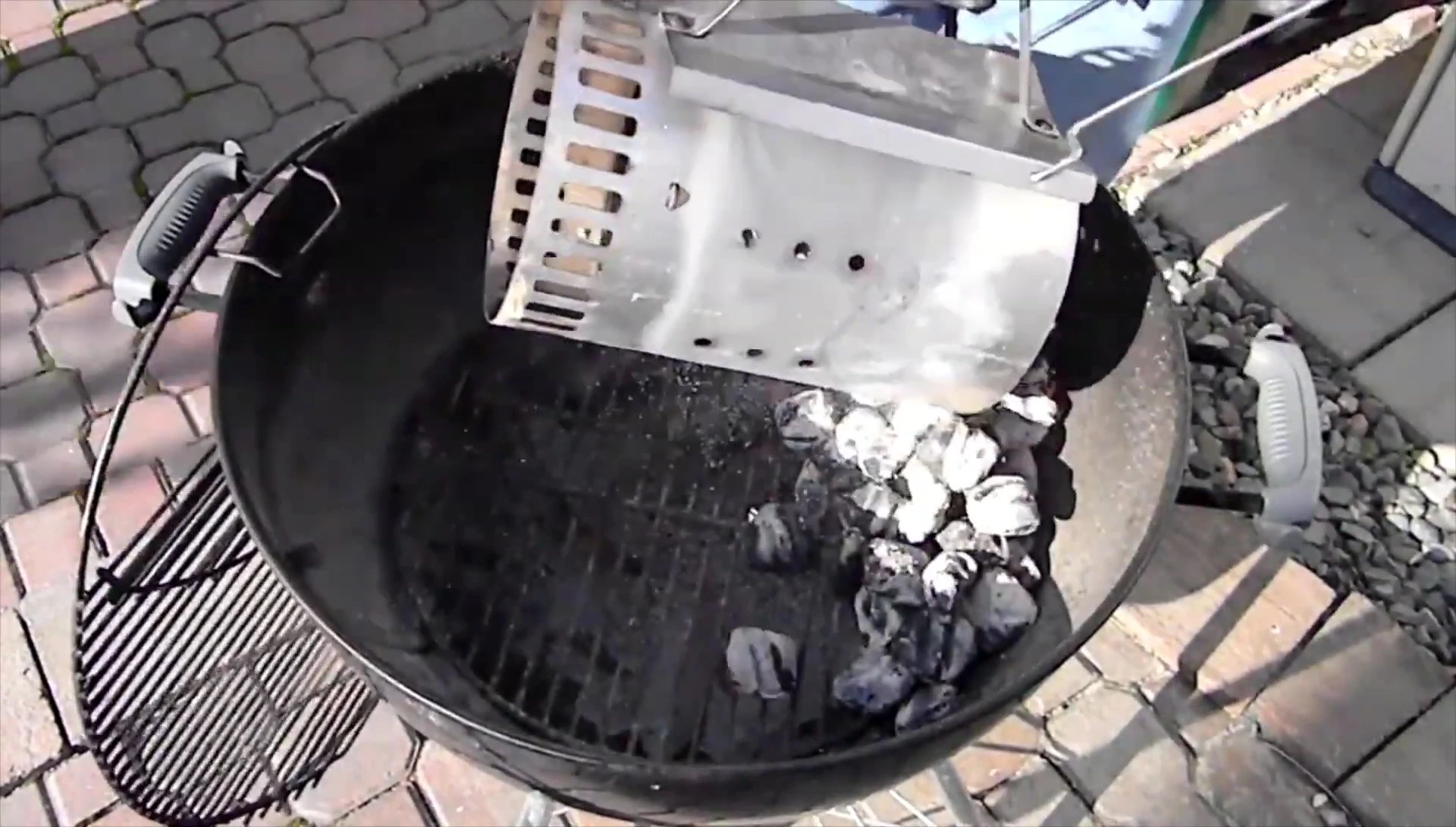Emptying the charcoal chimney