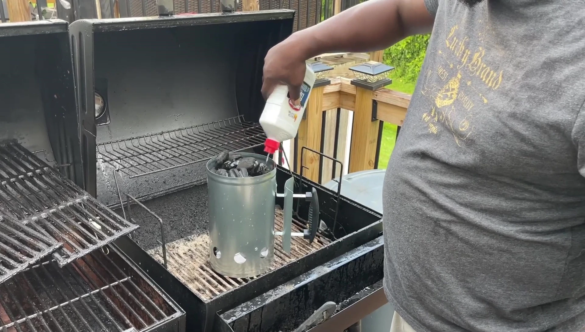 Adding lighter fluid to the chimney starter.