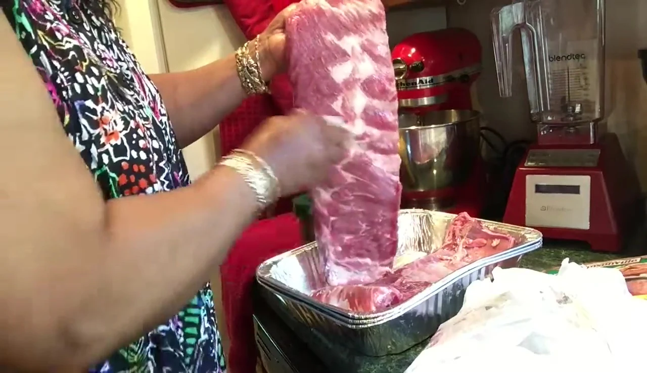 Patting down the ribs to remove excess moisture