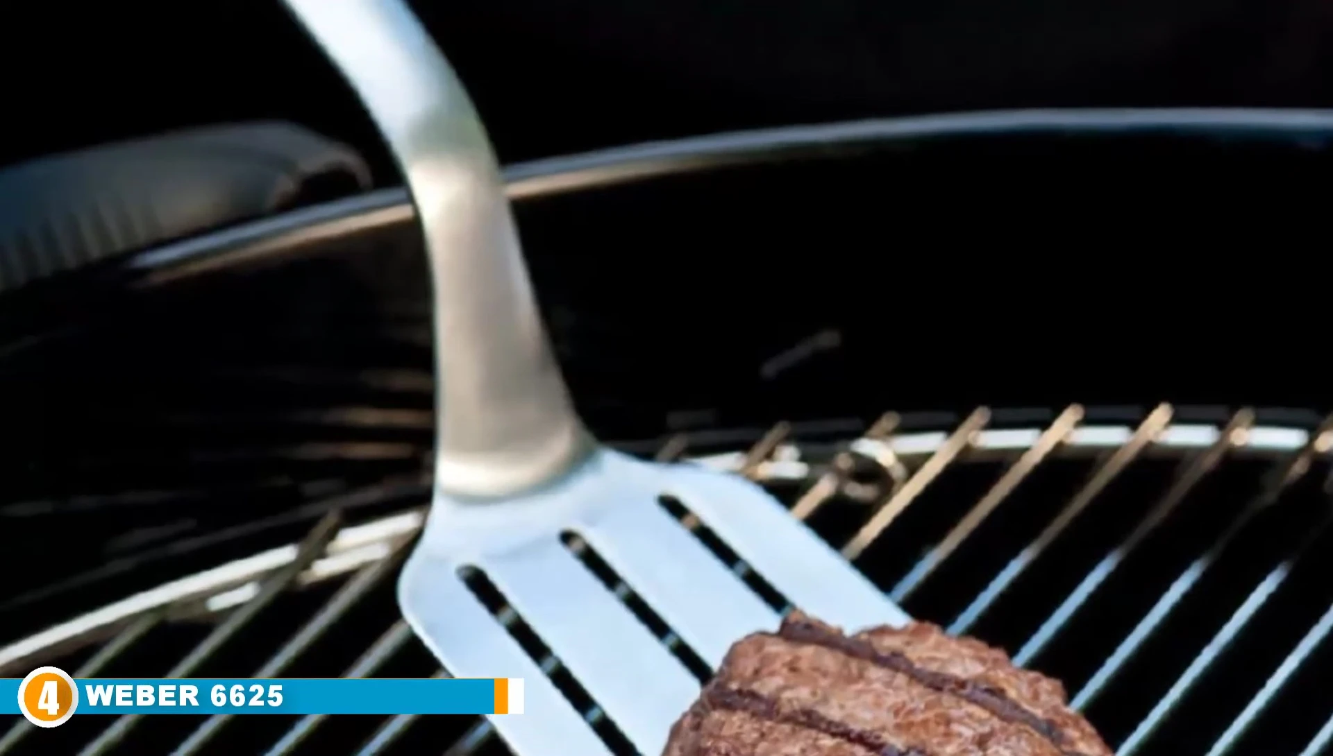 Close-up of Weber spatula and tongs