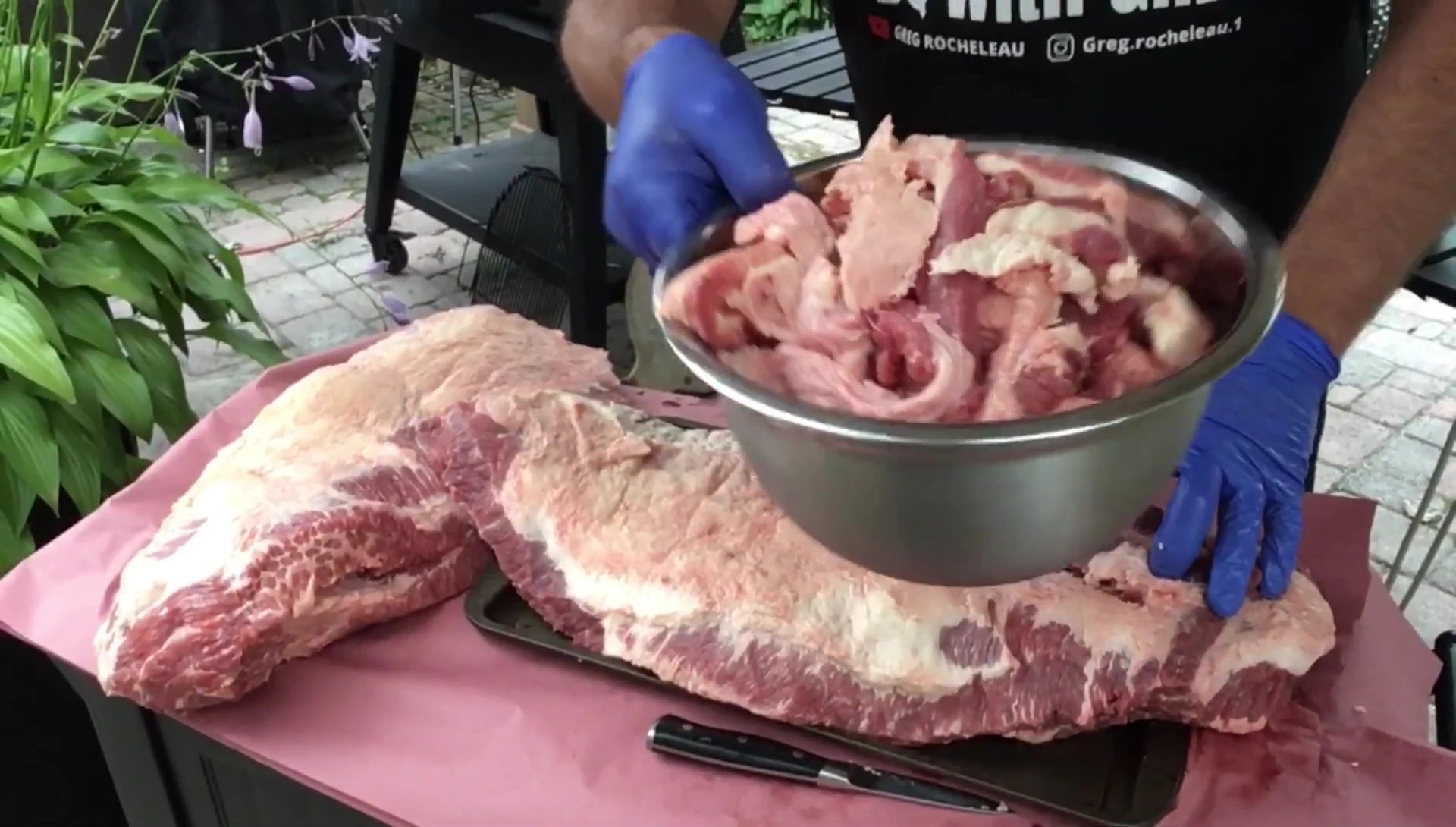 Trimming the fat from one of the briskets.
