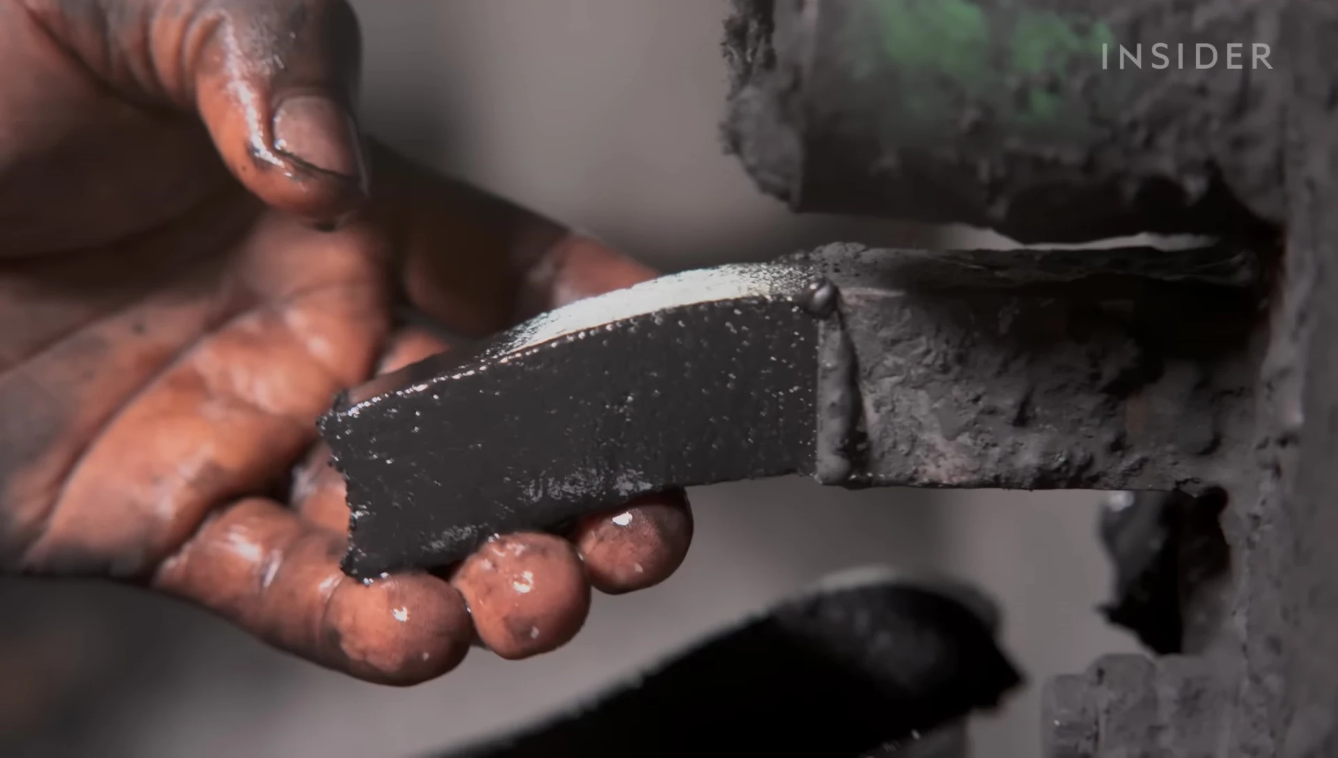 Image of the extruder creating the briquette logs.