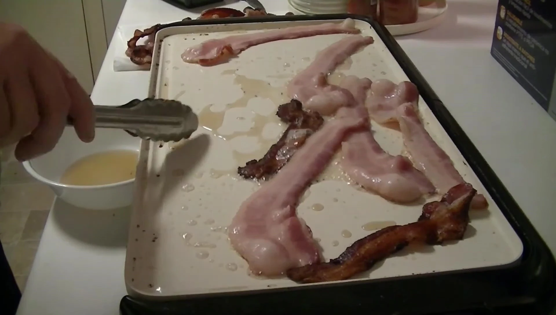 Demonstration of the non-stick surface and easy grease removal.