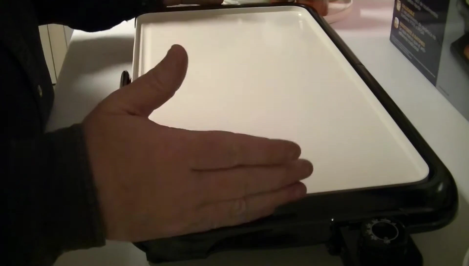 Comparison shot of the old and new griddles, highlighting the difference in size and shape.