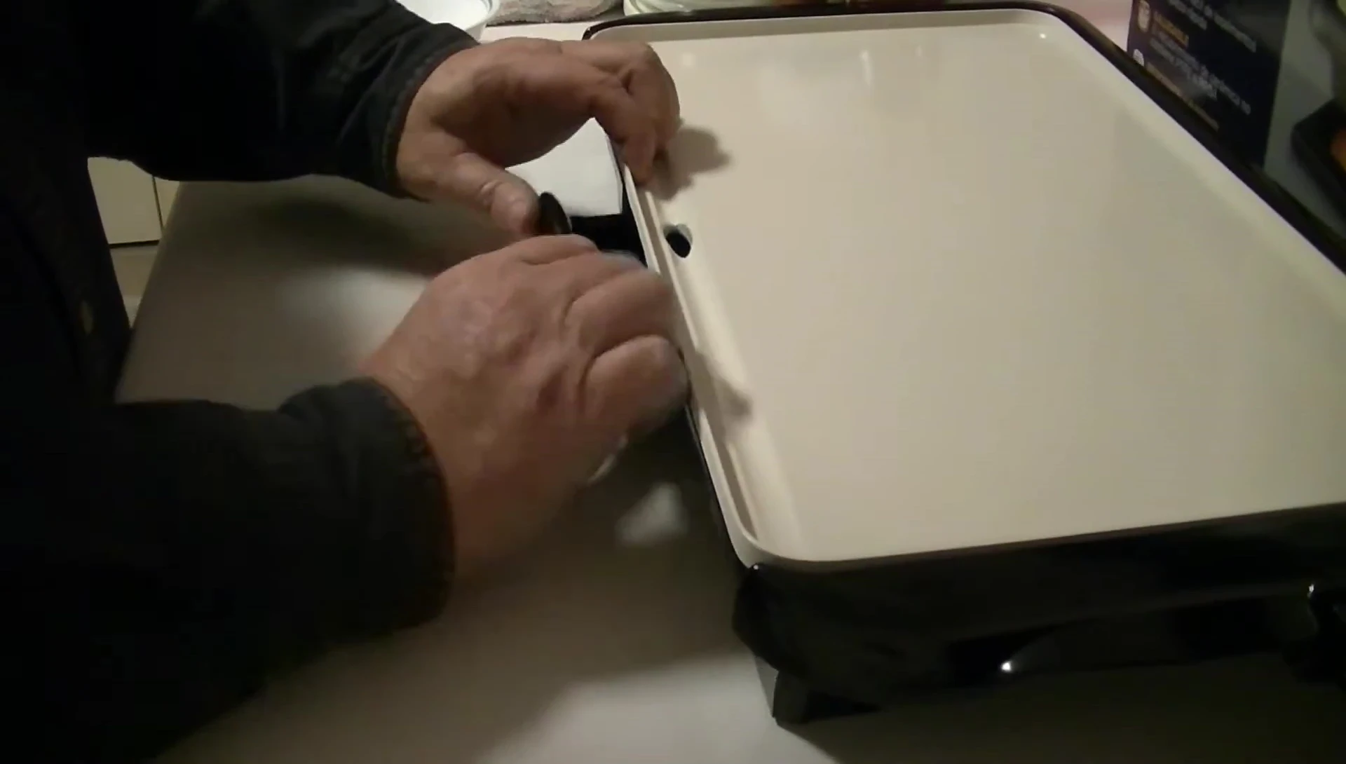 Shot showcasing the warming tray on the griddle.