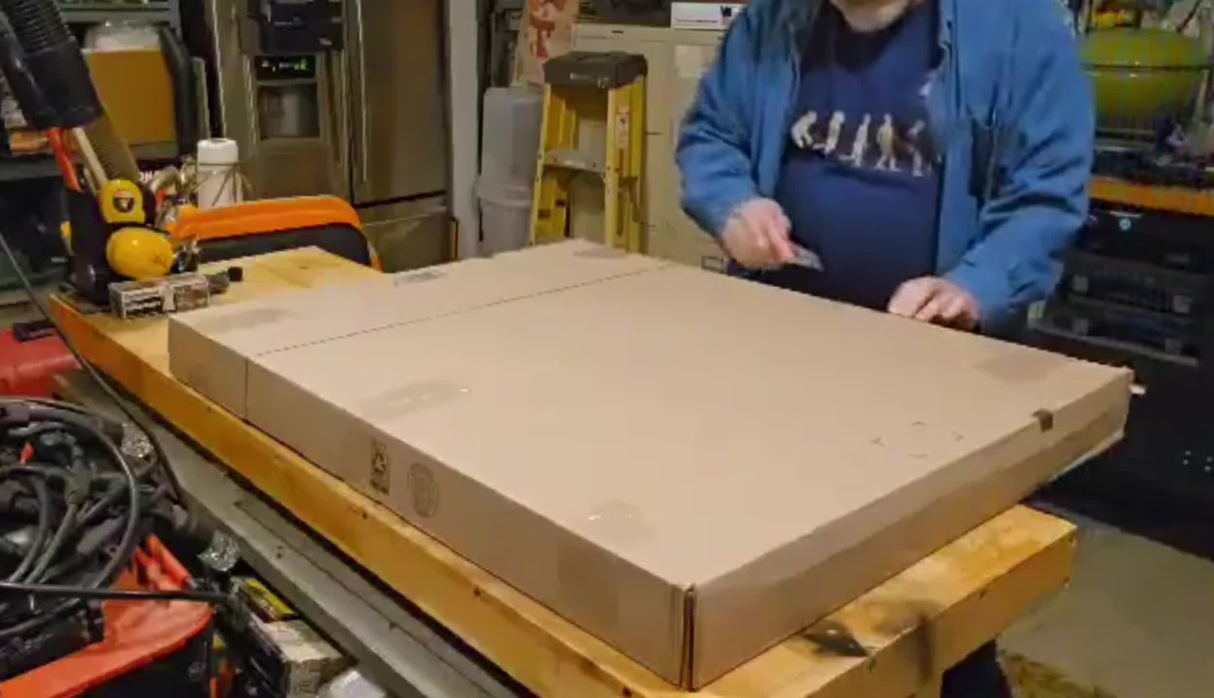 The OnlyFire cast iron grate in its initial overwrap packaging.