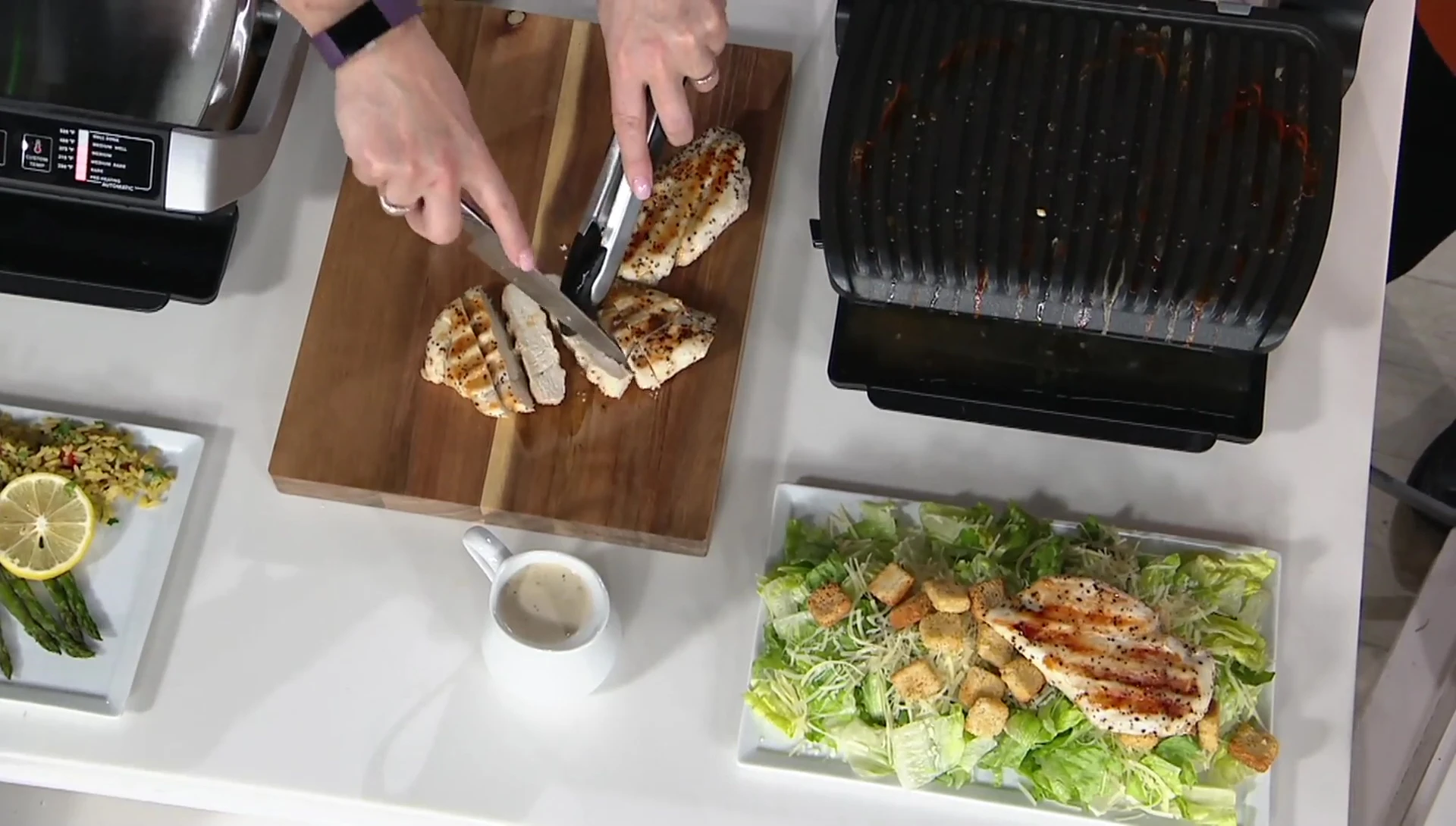 The perfectly grilled chicken breasts being shown.