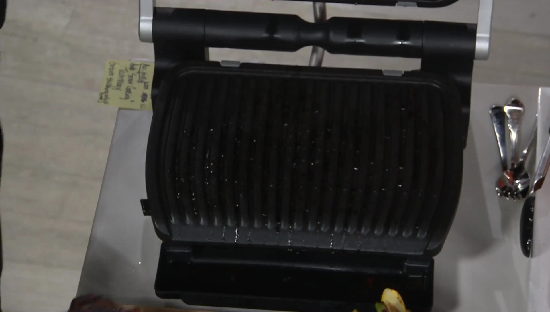 The perfectly grilled steaks shown by the host.