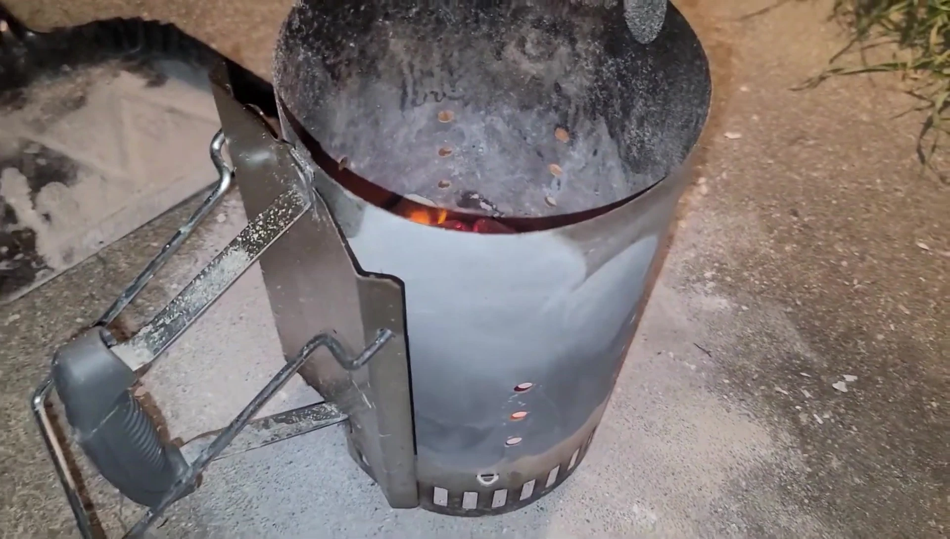 The Chimney-Mate grill placed on top of the charcoal chimney.