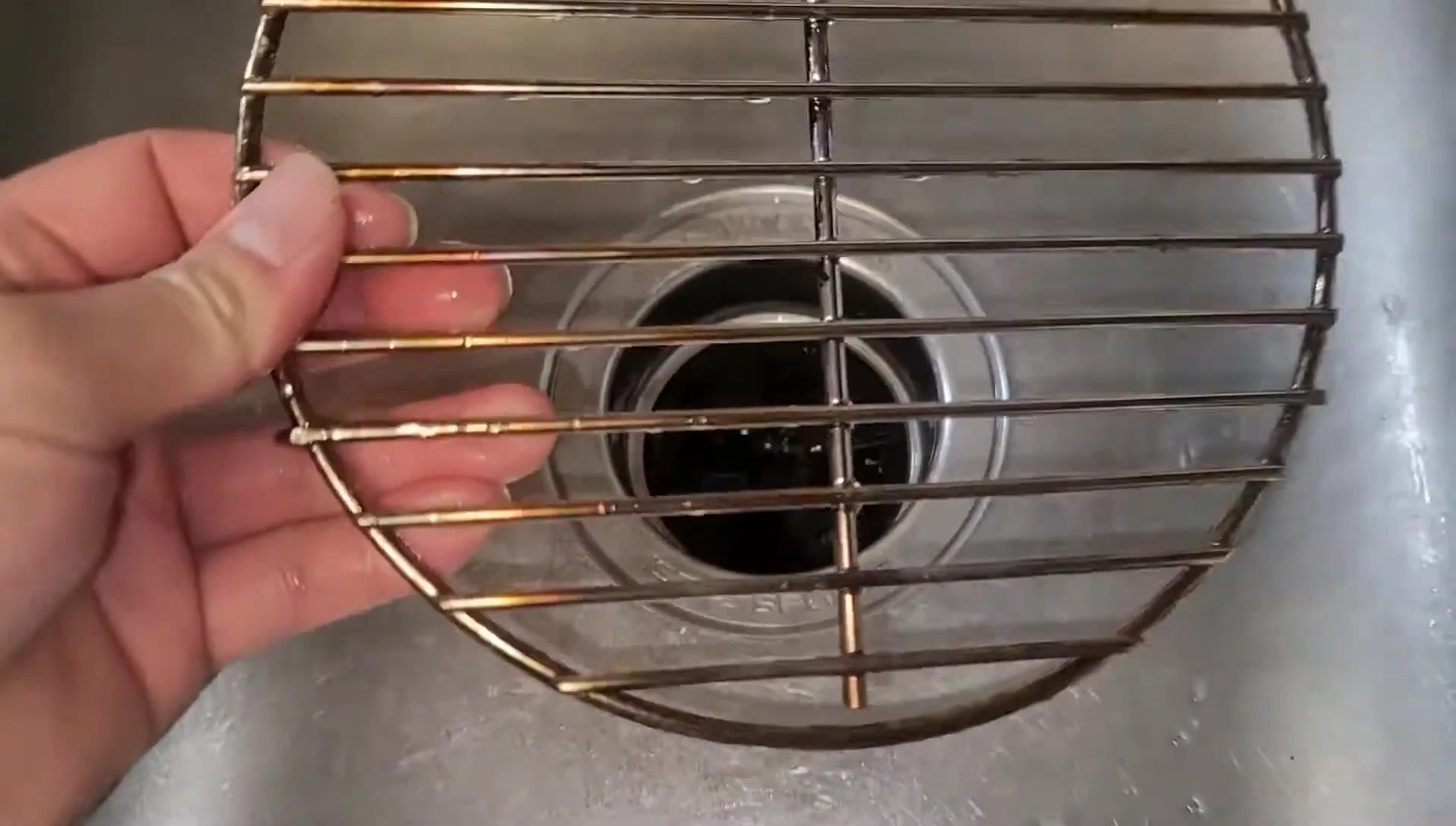 Cleaning the Chimney-Mate with steel wool.