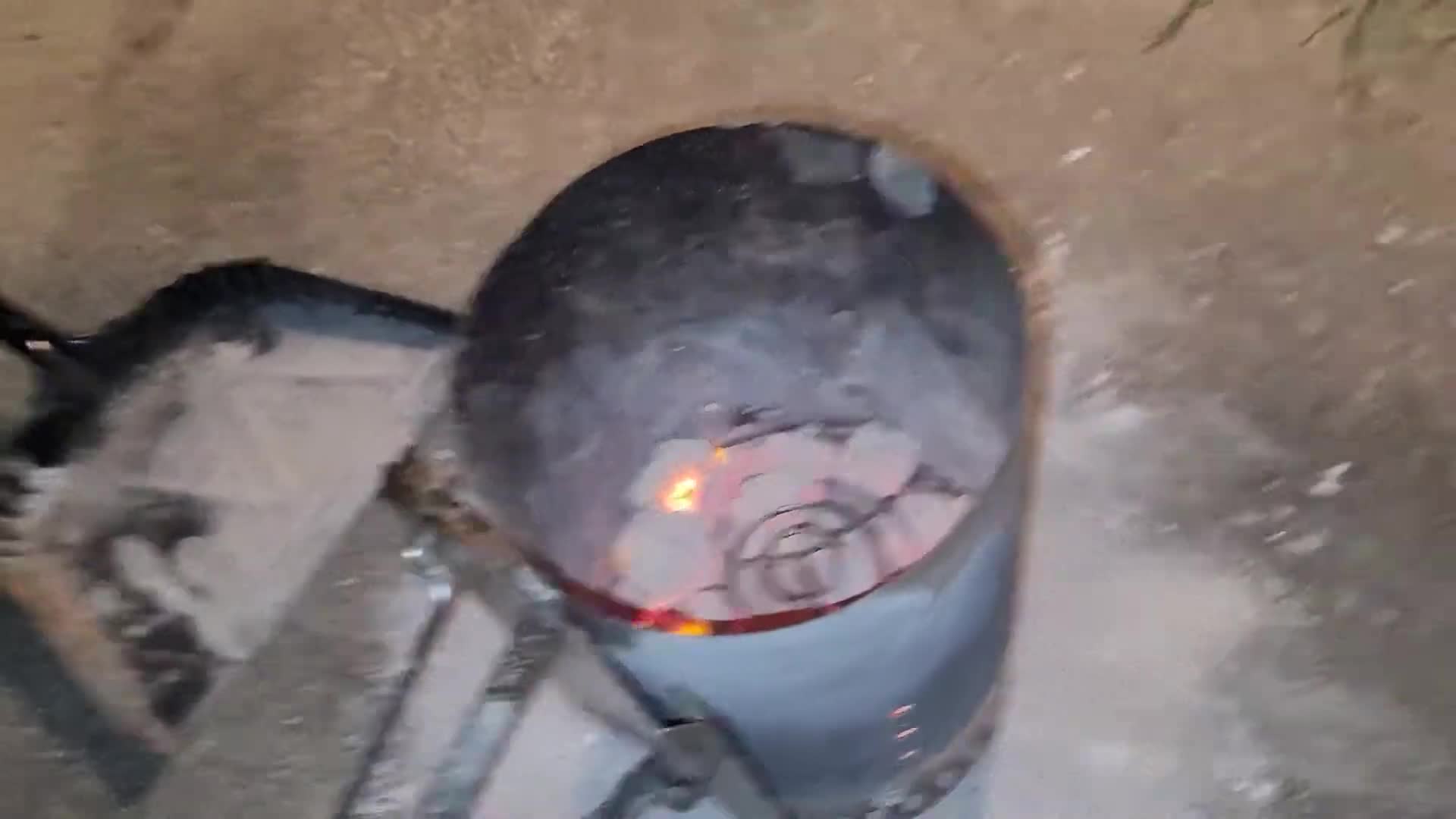 Charcoal being poured into the chimney starter.